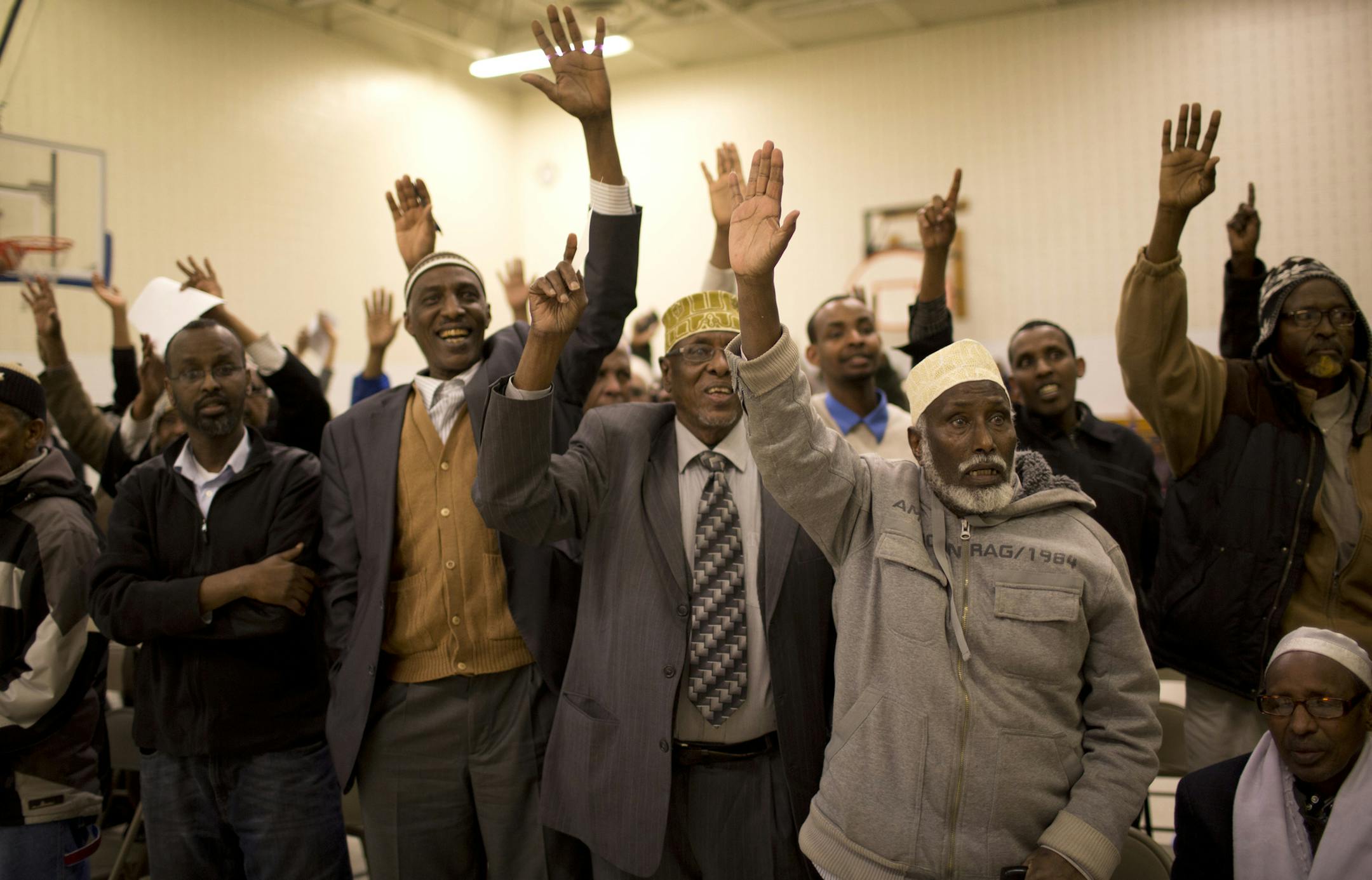 Hundreds of people crowded into the gym at the Bryan Coyle Center to participate in the Ward 6, Precinct 3 caucus Tuesday night, April 16, 2013 in Minneapolis, Minn. Causcus attendees who wanted to be elected to the Ward 6 convention raised their hands. ] JEFF WHEELER ‚Ä¢ jeff.wheeler@startribune.com