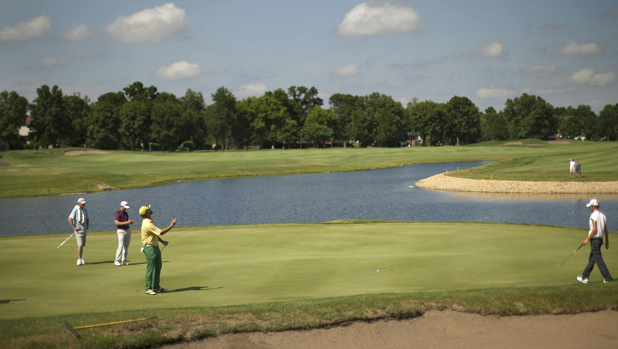 The Minnesota State Open Championship ended with a three way tie after 54 holes of golf at Edinburgh USA Golf Club in Brooklyn Park, Minn. Sunday afternoon, July 21, 2013. Jon DuToit birdied the first playoff hole to win the tournament. Clayton Rask reacted after his putt on the 17th hole fell just short Sunday afternoon. By the end of the next hole, he'd lost the lead and was tied with Sammy Schmitz, second from left, and eventual winner Jon DuToit, right, to force a playoff hole. ] JEFF WHEELE