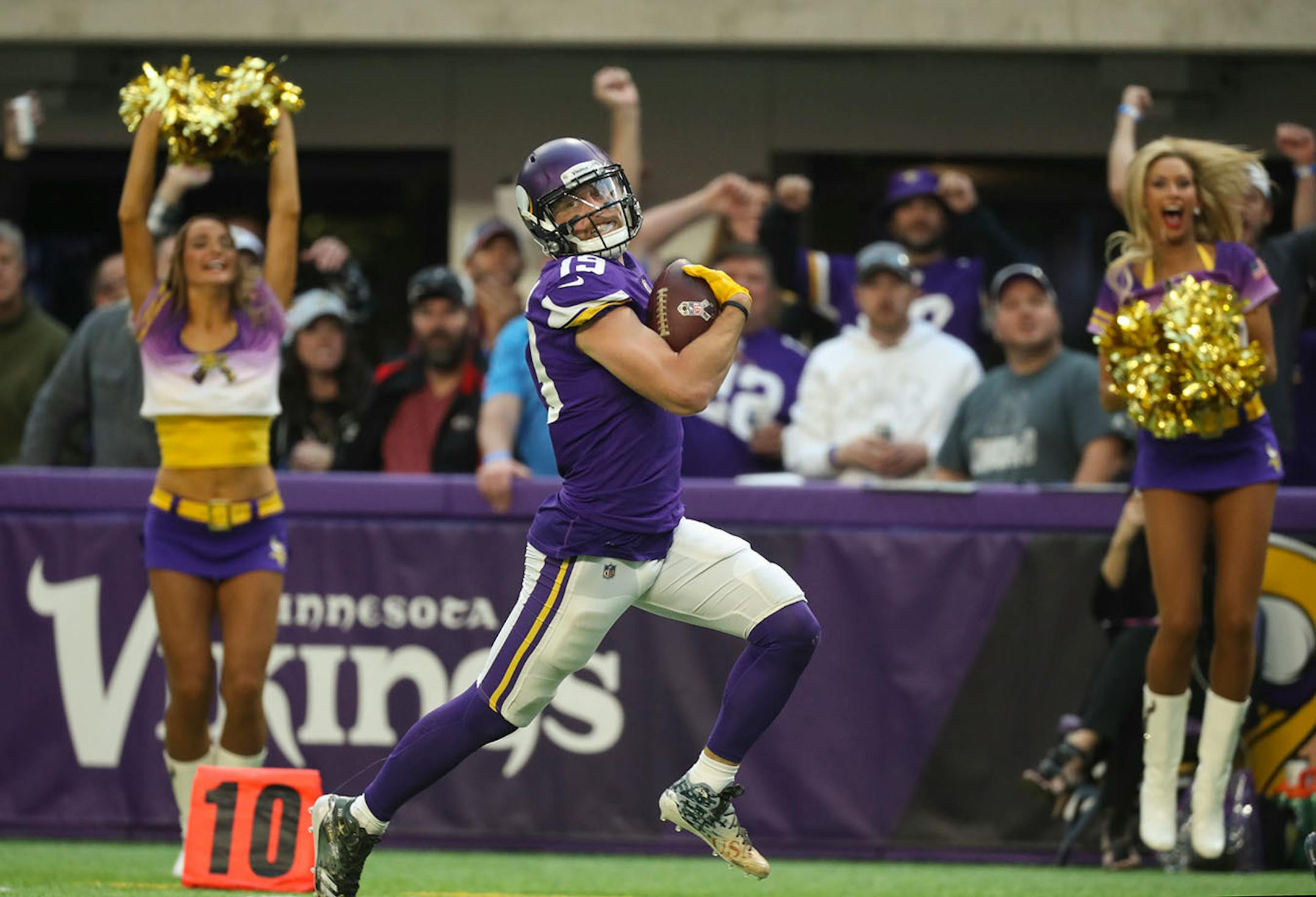 Minnesota Vikings wide receiver Adam Thielen looked back and smiled as he headed for the end zone on a 65 pass play for a fourth quarter touchdown.