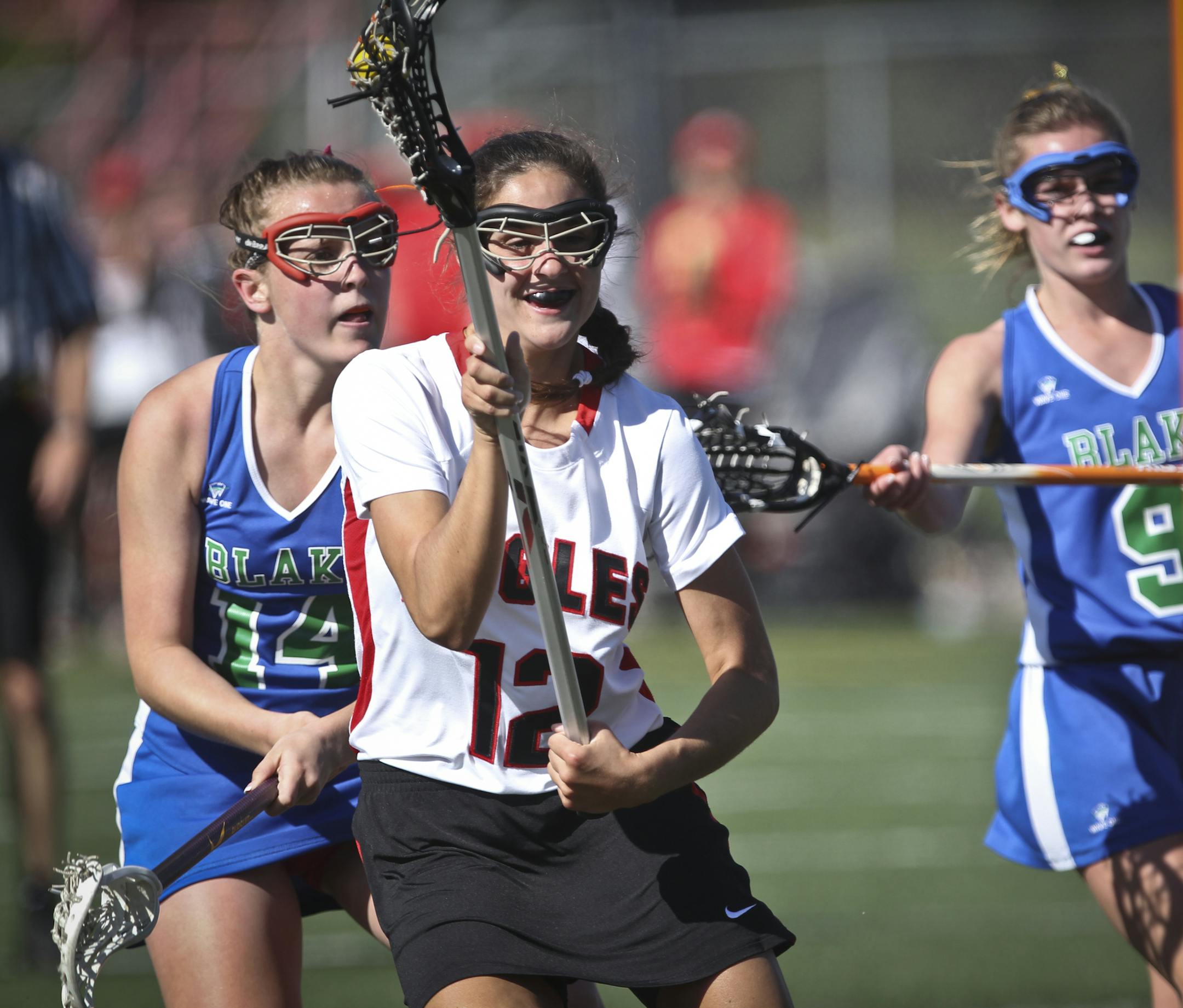 Eden Prairie's Emma Claire Fontenot wound up to score in the first half of a girls lacrosse game between Eden Prairie and The Blake School at Eden Prairie High School
