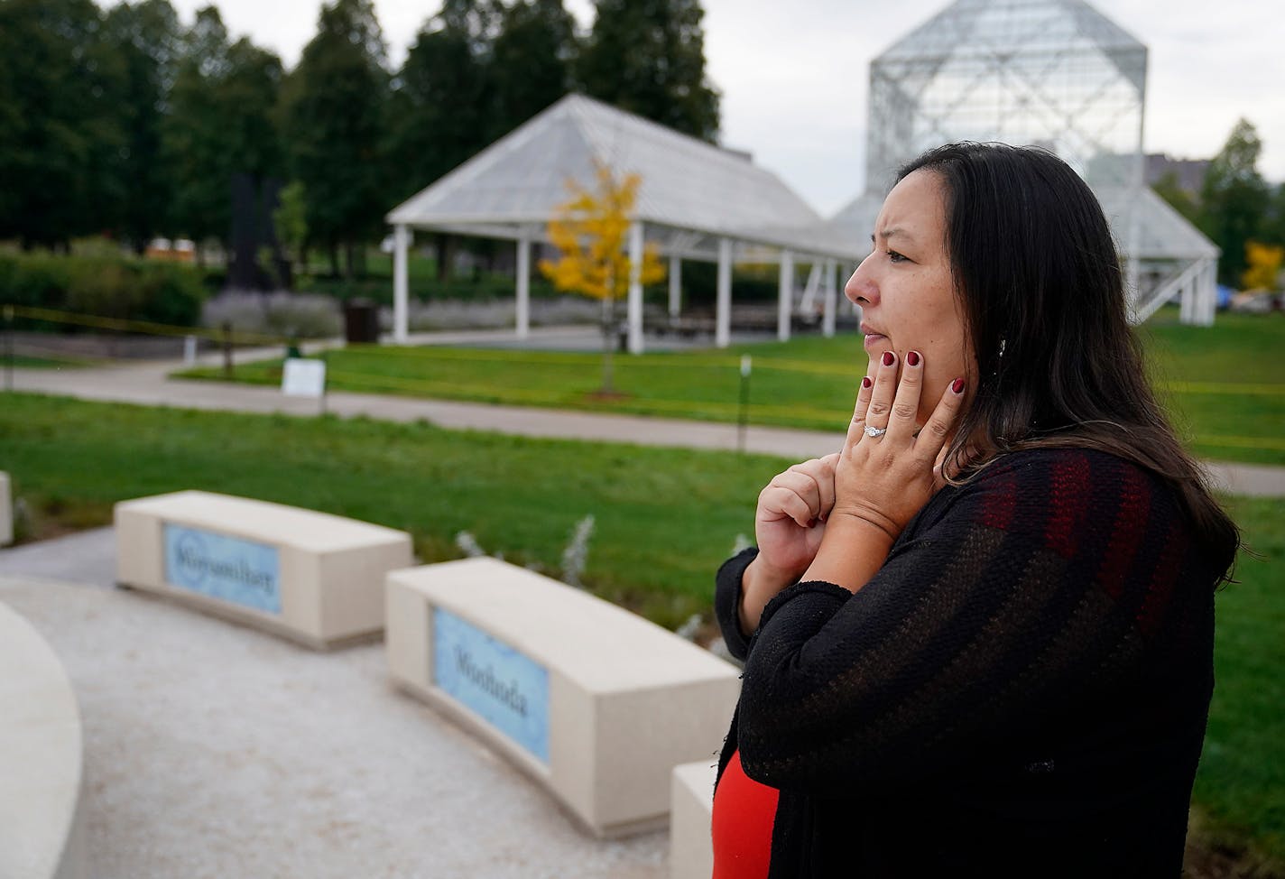 Angela Two Stars' new commission for the Minneapolis Sculpture Garden celebrates Dakota language and culture. Entitled: Okciyapi, meaning help each other, Two Stars was photographed sitting for a portrait next to her new art piece installed at the Sculpture Garden Friday in Minneapolis. ]