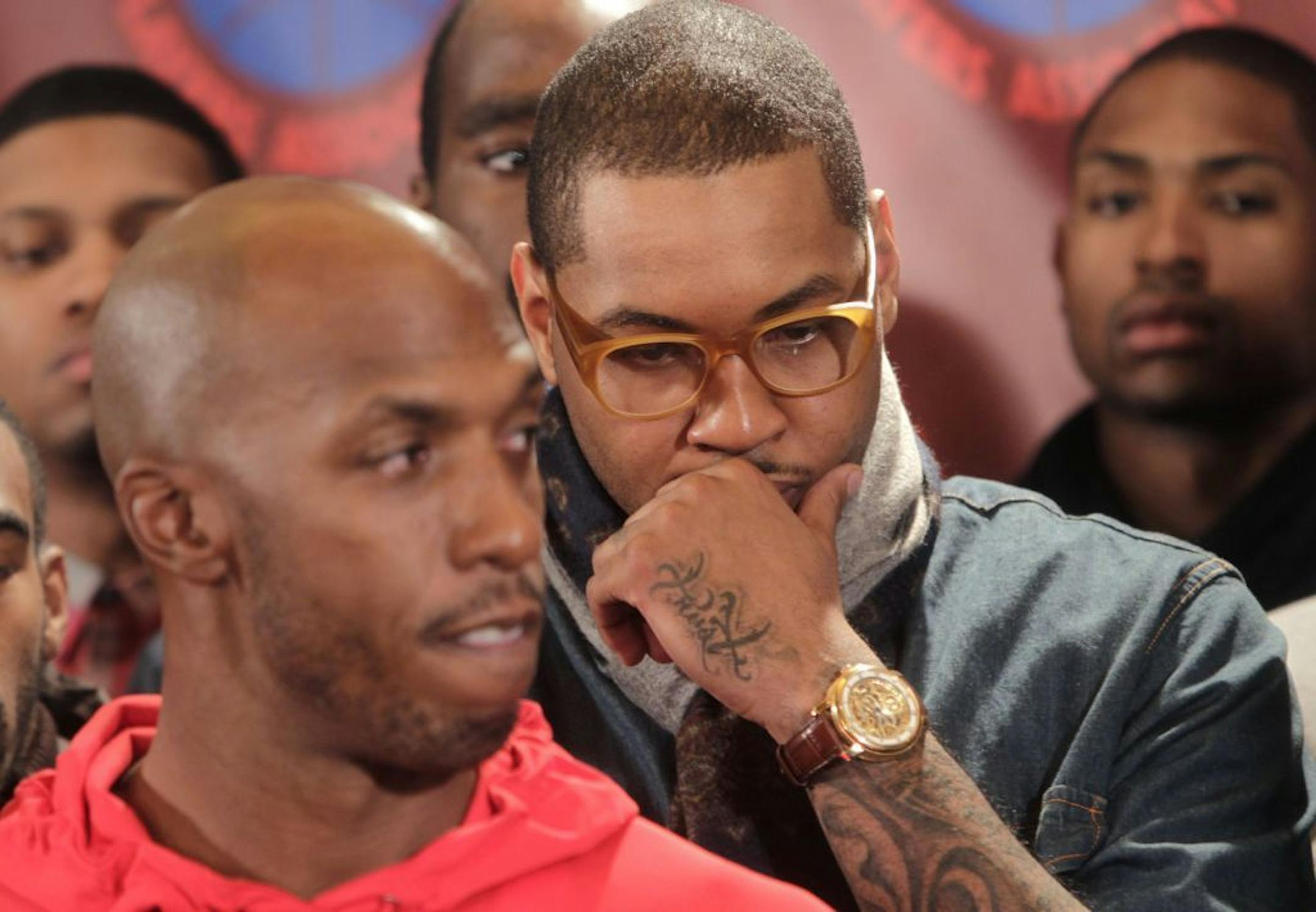 NBA players, including the New York Knicks' Carmelo Anthony, center, listened to players' union representatives speak during a news conference in New York on Monday.