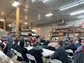 A farmer stands to address legislative agriculture leaders at the headquarters of Smude Sunflower Oil in Pierz, Minn., on Jan. 20.