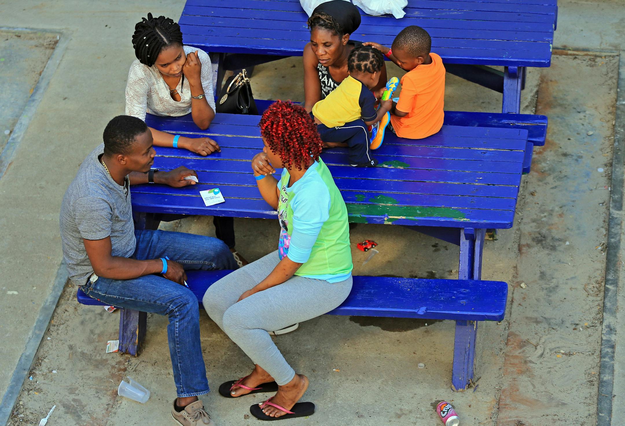 Migrants are seen in a courtyard at the Canadian Olympic Stadium that is being used as a shelter on Monday, Aug. 14, 2017. Thousands of people have crossed over into Canada from an irregular crossing near the Champlain-St. Bernard de Lacolle border in hopes of finding residency in Canada. Among them are Haitians who worry that their Temporary Protected Status in the U.S. could soon end under the Trump administration. (Al Diaz/Miami Herald/TNS)