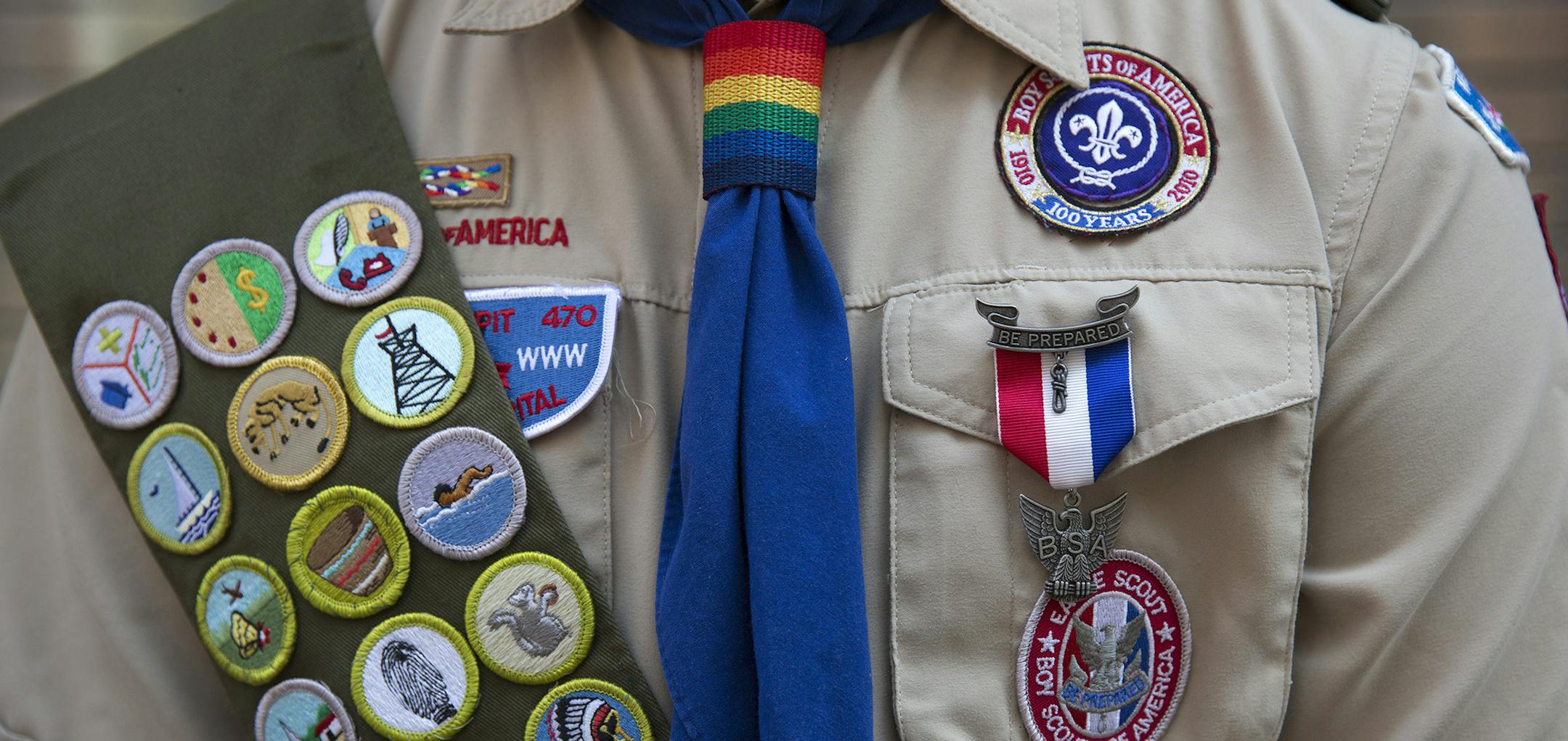 FILE -- Eagle Scout Pascal Tessier, who is openly gay, in the annual Gay Pride March in New York, June 29, 2014. Reversing its stance of more than a century, the Boy Scouts of America said on Monday that the group would begin accepting members based on the gender listed on their application, paving the way for transgender boys to join the organization. (James Estrin/The New York Times) ORG XMIT: MIN2017013114302441