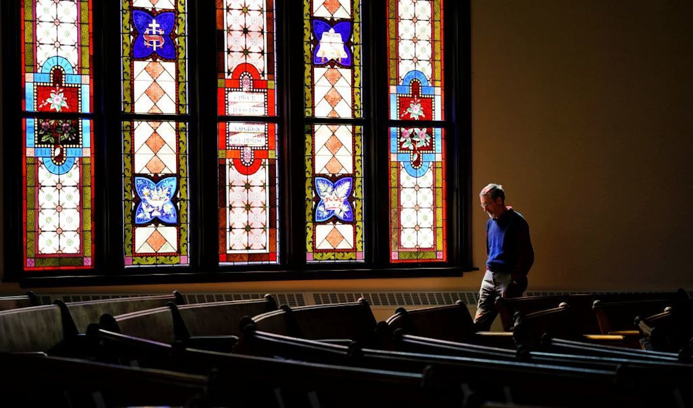 Members of prayer group that meets four days a week gather for what they call centering prayer, silent prayer/contemplation in the church sanctuary of First United Church of Christ. David Walters walked the church after the centering prayer group.