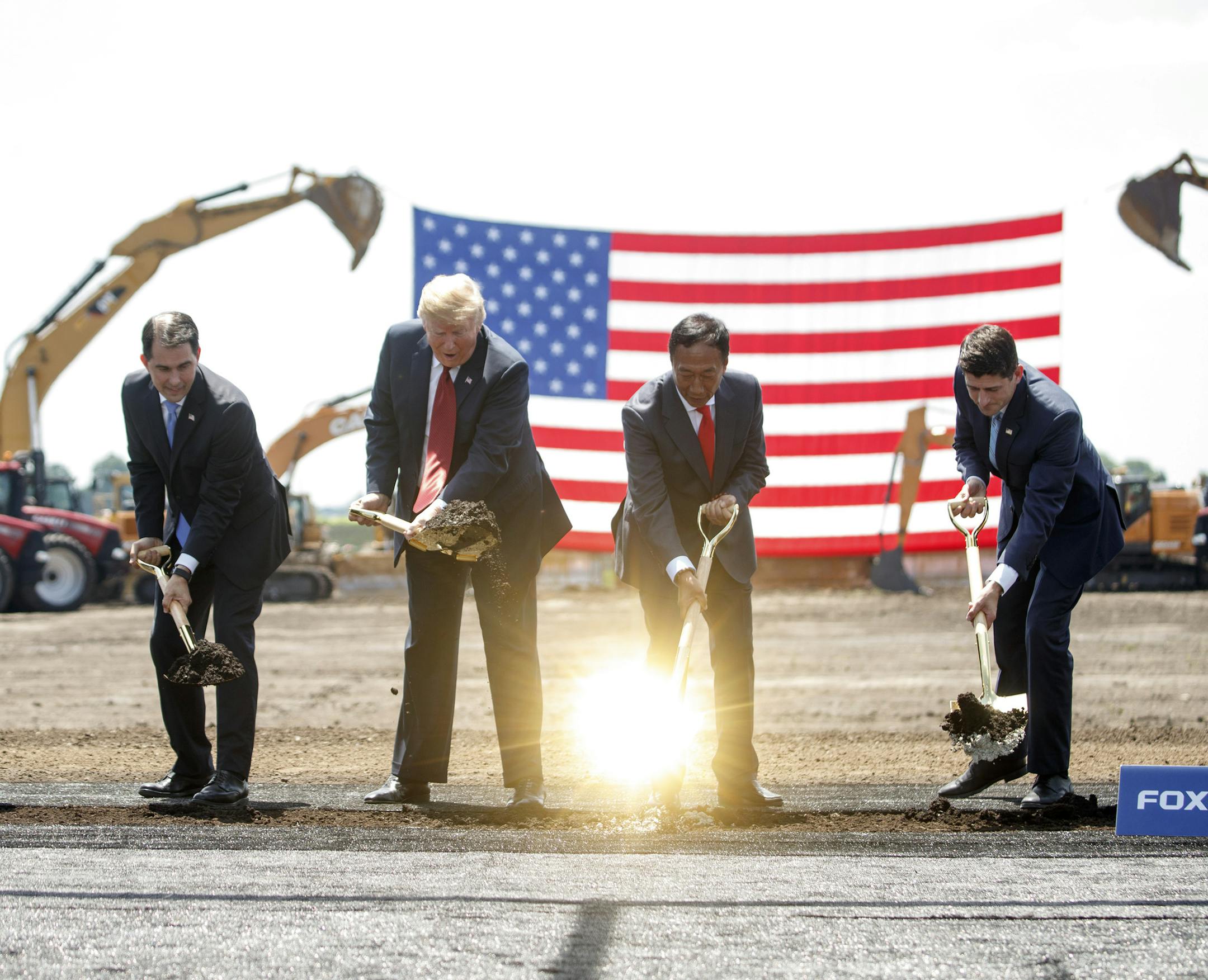 President Donald Trump participates in the groundbreaking for a $10 billiob Foxconn factory complex in Mount Pleasant, Wis., June 28, 2018. From right: House Speaker Paul Ryan (R-Wis.); Terry Gou, chairman of Foxconn; Trump; and Wisconsin Gov. Scott Walker. (Tom Brenner/The New York Times) ORG XMIT: MER0c20102a946c4b08666f2f9e020cb