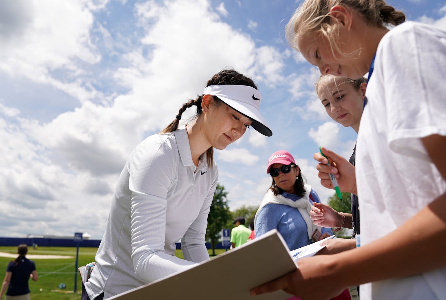 Michelle Wie signed autographs for fans after putting on the 1st hole green Tuesday afternoon. ] ANTHONY SOUFFLE &#x2022; anthony.souffle@startribune.com Players took part in the official Pro-Am tournament and practice day for KPMG Women's PGA Championship Tuesday, June 18, 2019 at Hazeltine National Golf Club in Chaska, Minn.