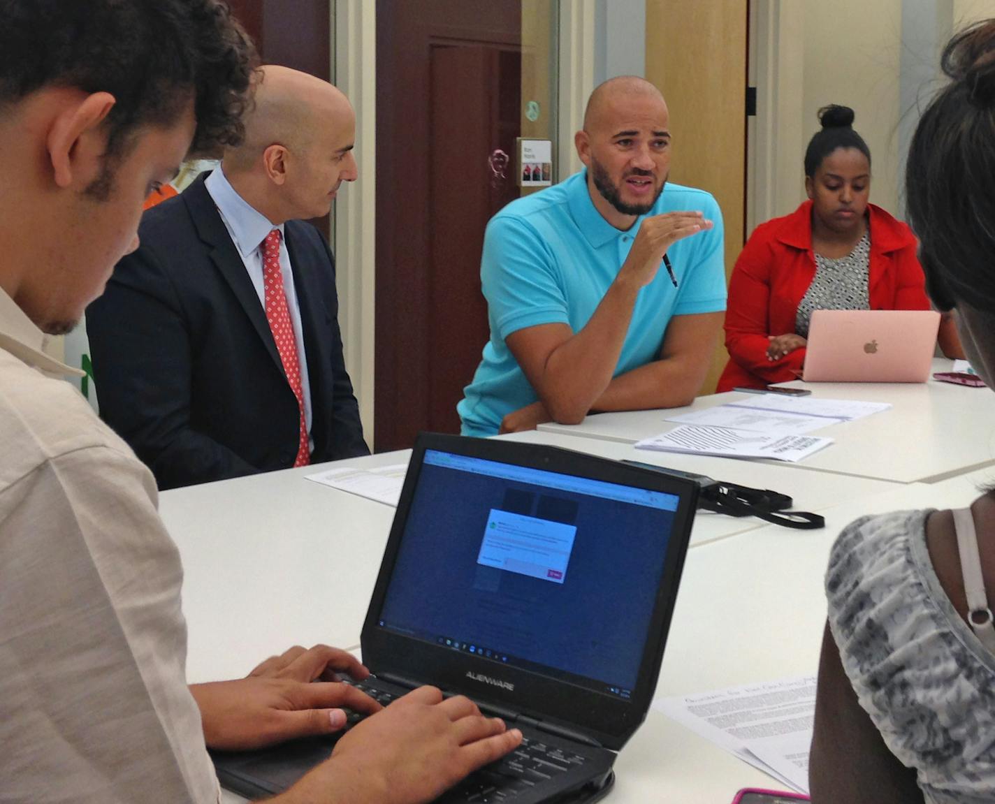 Photo ID: 14673 Caption: Minneapolis Fed President Neel Kashkari, left, ( navy jacket red tie) meets with representatives from Neighborhoods Organizing for Change in North Minneapolis to discuss racial economic disparities. Anthony Newby, NOC's executive director, is seated next to Kashkari. (un blue polo). Photo: Adam Belz | Star Tribune | 612-673-4405