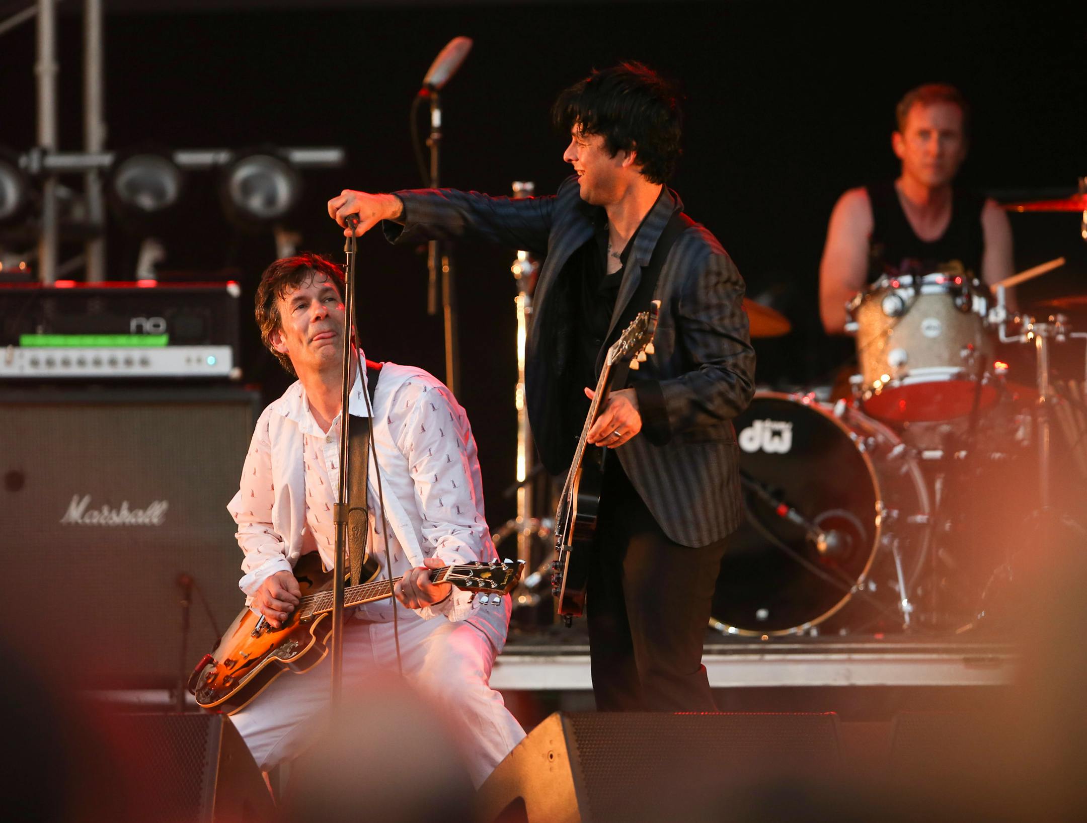 A consumate sideman, Billy Joe Armstrong gave Paul Westerberg a helping hand with his mic stand after it collapsed during The Replacements show at the Forecastle Festival Sunday evening. ] JEFF WHEELER • jeff.wheeler@startribune.com The Replacements played a show at the Forecastle Festival in Louisville, Kentucky Sunday night, July 21, 2014.