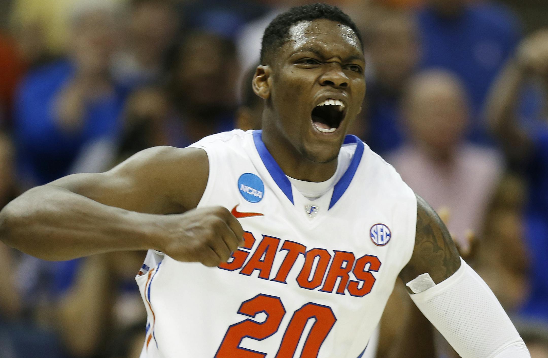 Florida guard Michael Frazier II (20) celebrates a goal against UCLA during the second half in a regional semifinal game at the NCAA college basketball tournament, Thursday, March 27, 2014, in Memphis, Tenn. Florida won 79-68. (AP Photo/John Bazemore)