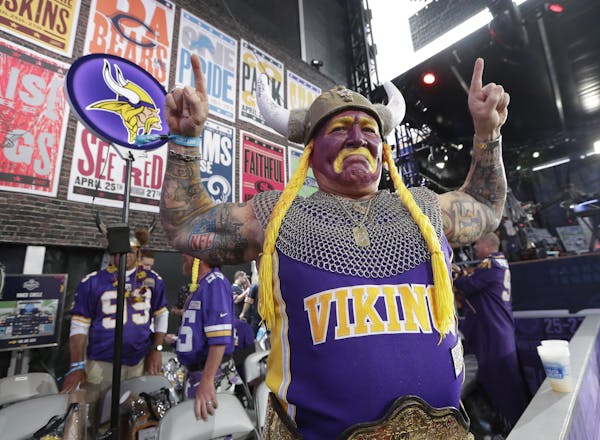 Minnesota Vikings fan Syd Davy cheers ahead of the first round at the NFL football draft, Thursday, April 25, 2019, in Nashville, Tenn. (AP Photo/Mark