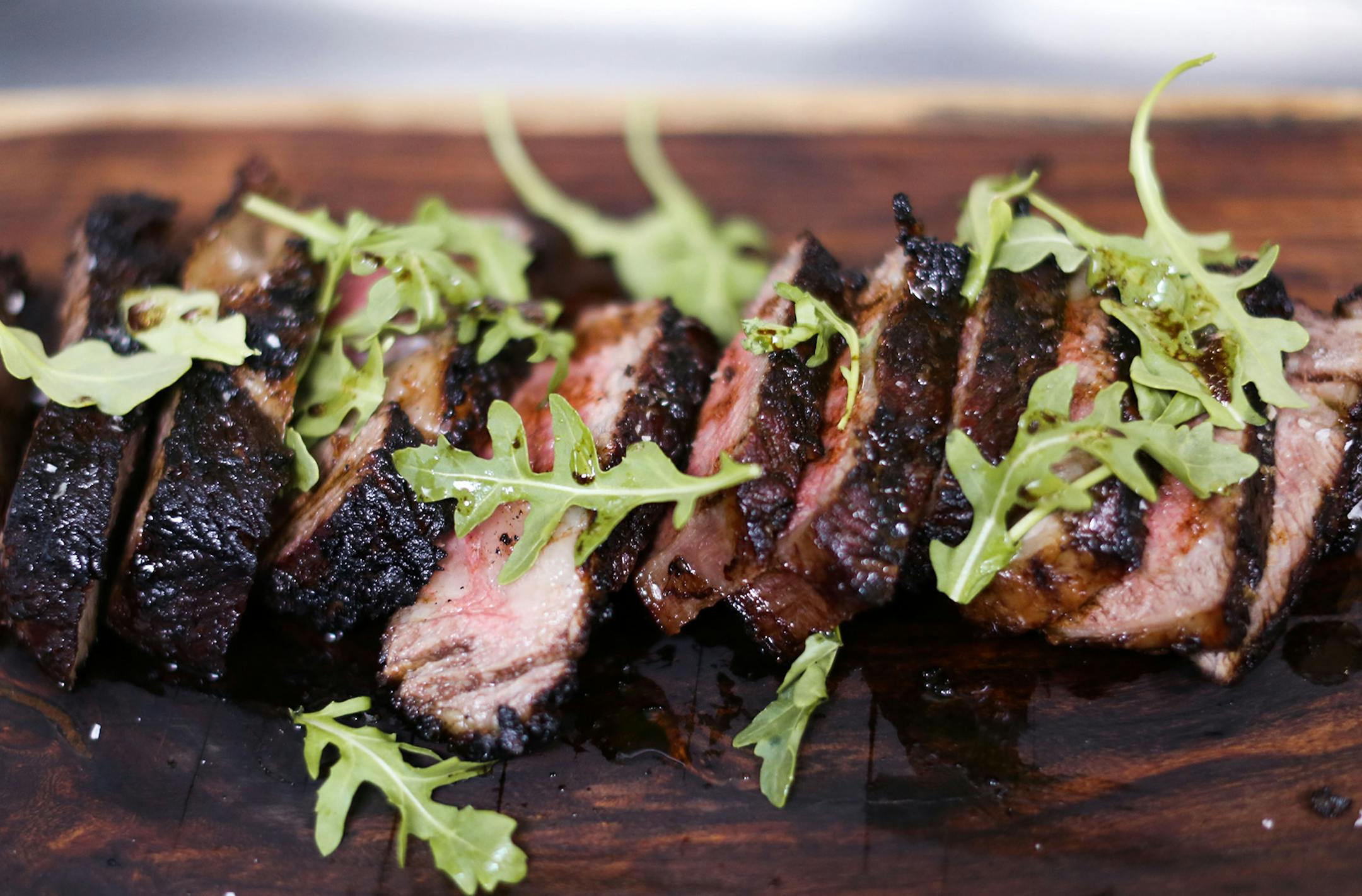 Tribune Media Services Tagliata of Bone-In Rib Eye with Arugula. ORG XMIT: tms20130605175829