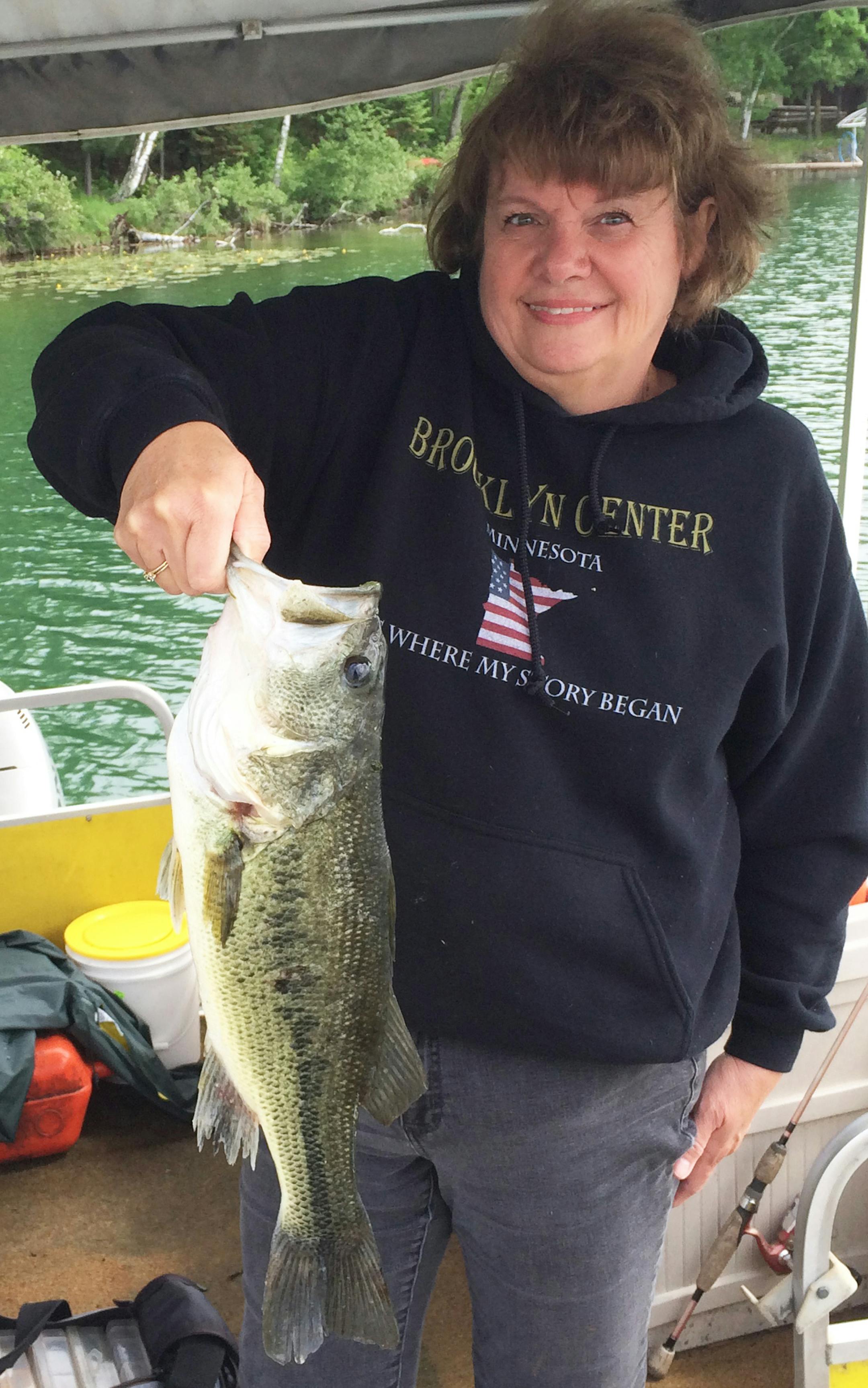 HEAVY FISH, LIGHT LINE Gail Gregory of Coon Rapids caught this nice largemouth bass on Deep Portage Lake near Backus. She only had on 2-pound test line, so it took her about 15 minutes to land it. After a quick picture, it was returned to the water.