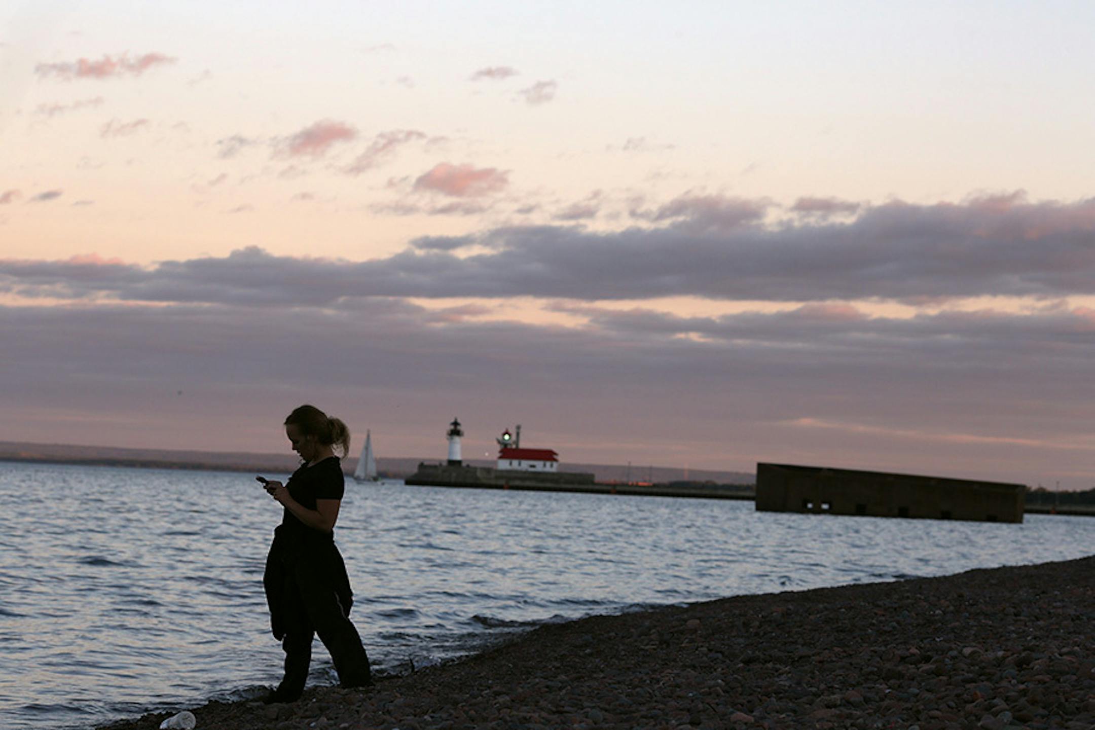 A woman picked rocks from the shoreline of Lake Superior Tuesday August 26, 2015 in Duluth, MN. A profile on the resurgence of Duluth.
