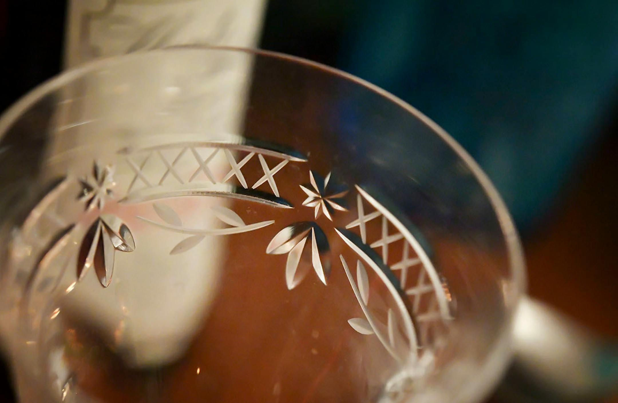 For the rest of the display, choose items with a variety of finishes and textures, such as cut crystal wine glasses.