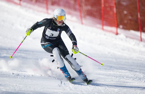 Duluth East alpine skier Lauren Carlson (3) makes her second run at the Minnesota State High School League Boys and Girls Alpine Skiing State Meet Wed