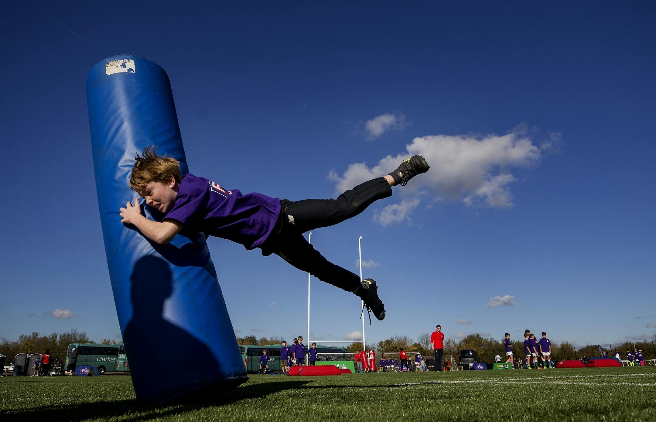 A young athlete worked on tackling drills during a NFL FLAG event after Minnesota Vikings practice at the London Irish Training Ground.