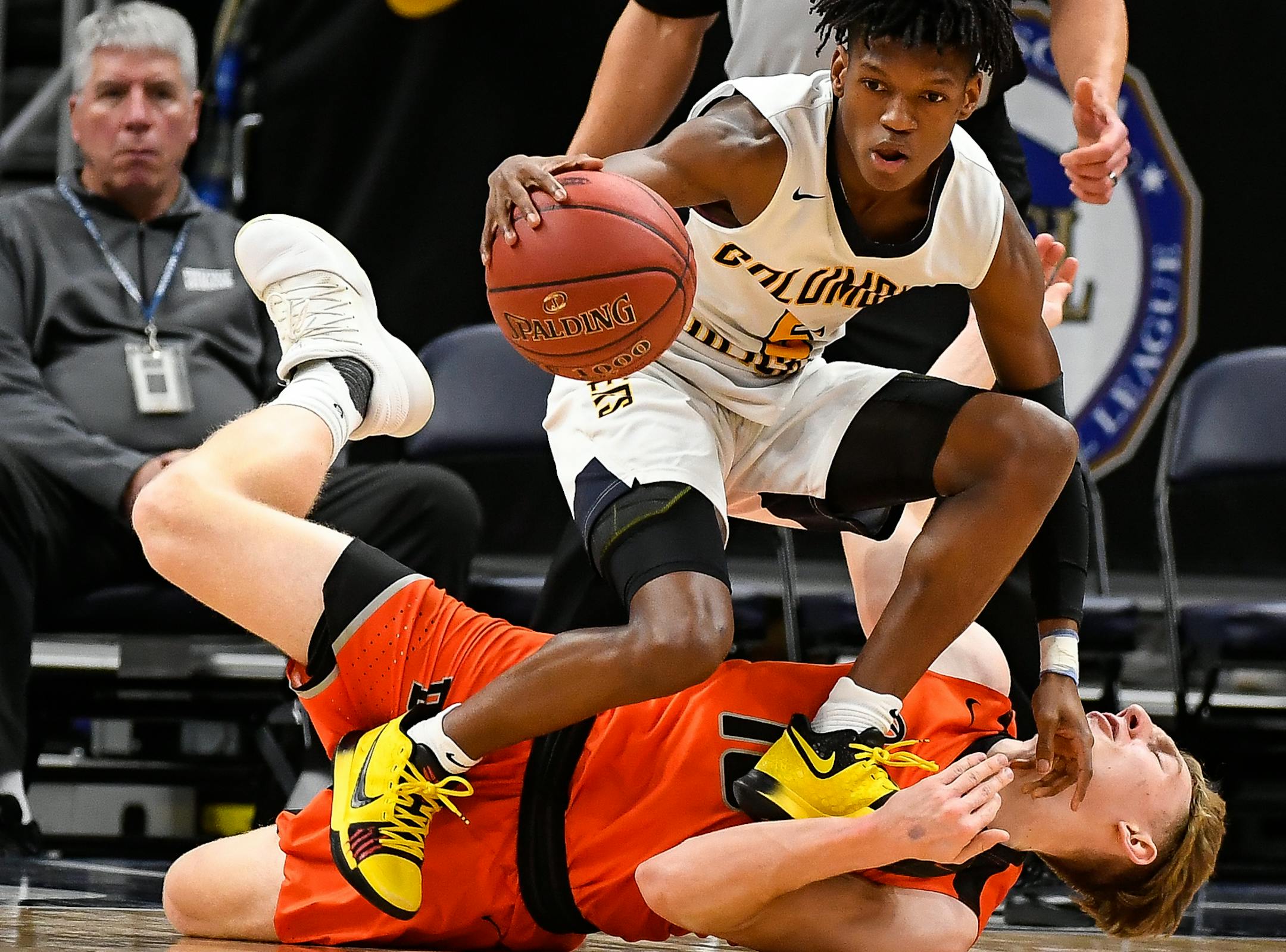 Columbia Heights guard Quentin Hardrict (5) and Delano guard Calvin Wishart (10) collided in the first half as Wishart turned the ball over. ] AARON LAVINSKY ï aaron.lavinsky@startribune.com Delano played Columbia Heights in the Class 3A boy's basketball championship game on Saturday, March 24, 2018 at Target Center in Minneapolis, Minn.