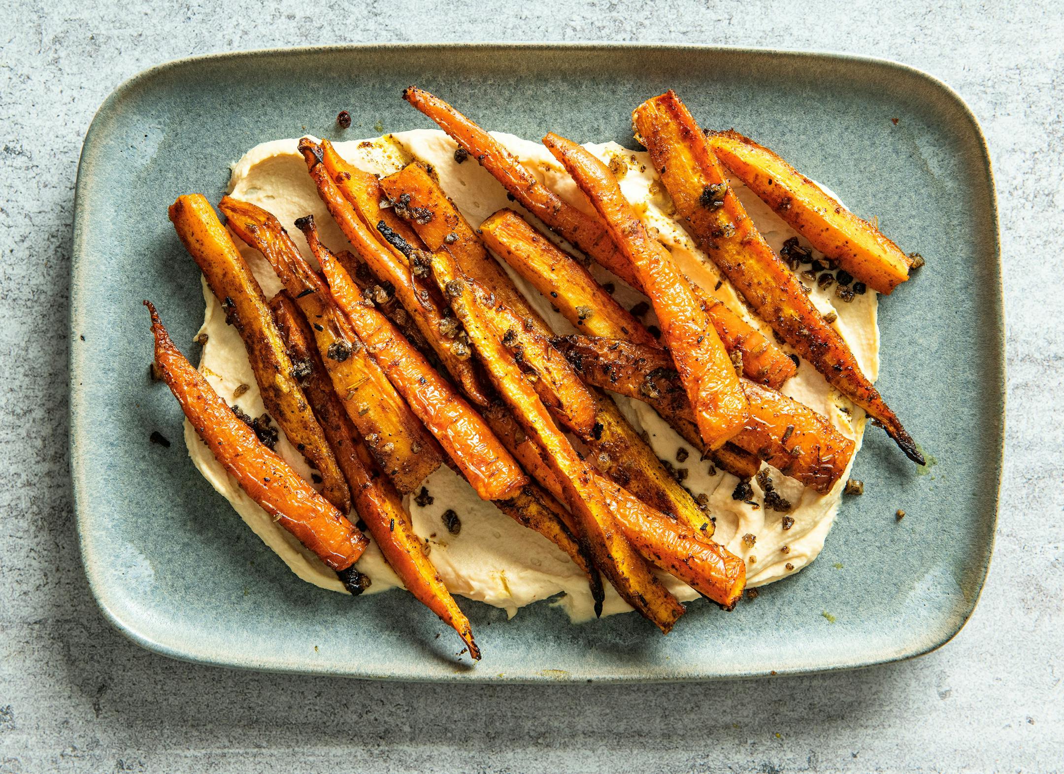 Roasted carrots, hummus and za'atar combine to make a tasty appetizer or light entree. Recipe from Beth Dooley, Photo by Mette Nielsen, Special to the Star Tribune