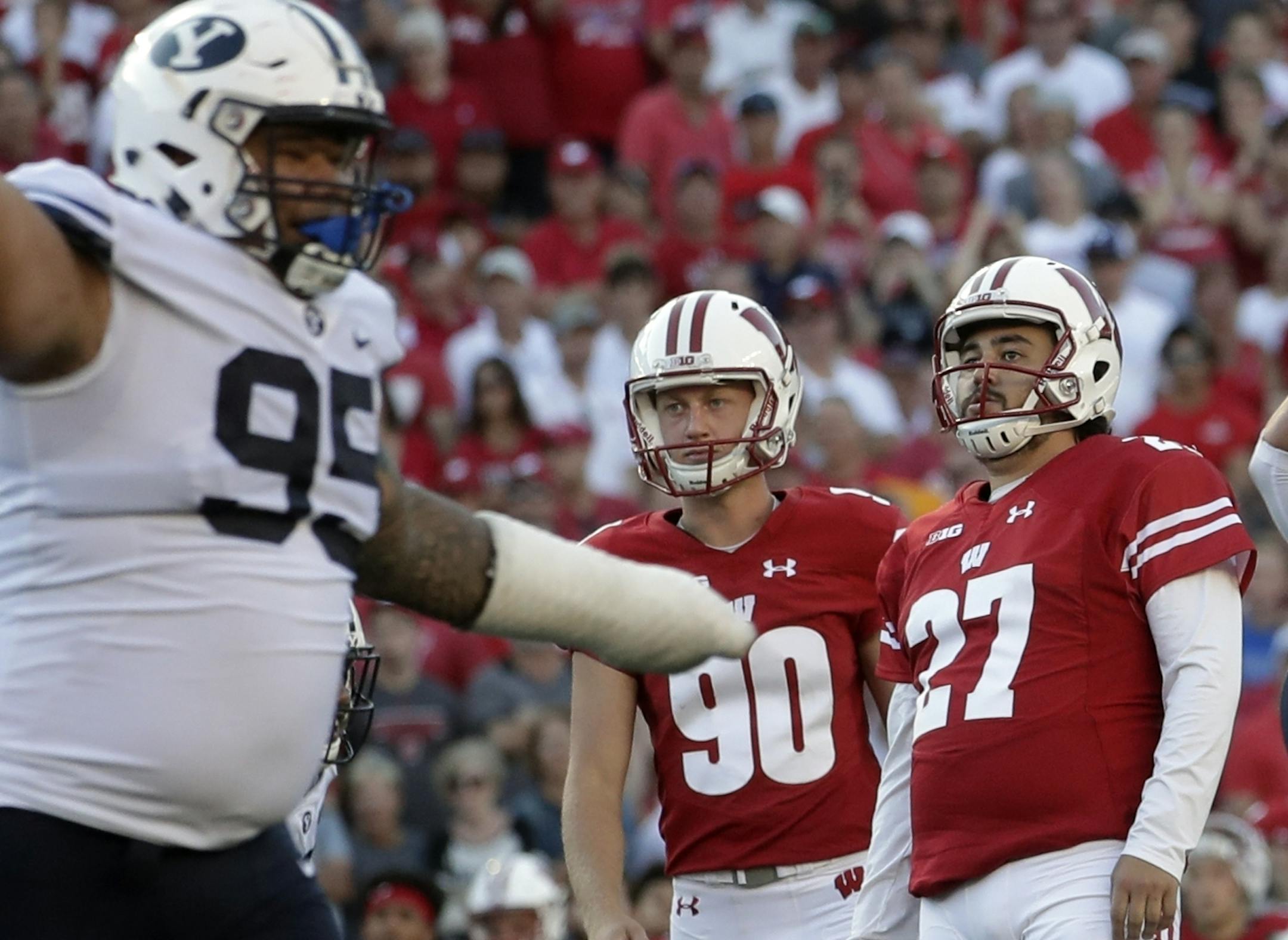 FILE - In this Saturday, Sept. 15, 2018, file photo, Wisconsin kicker Rafael Gaglianone (27) reacts after he missed a field goal in the final seconds of the second half of an NCAA college football game against BYU in Madison, Wis. Traditional Big Ten powers Wisconsin, Michigan and Michigan State have lost out-of-conference games. Slow starts, however, doesnít mean the conference is out of the national title hunt. (AP Photo/Morry Gash, File)