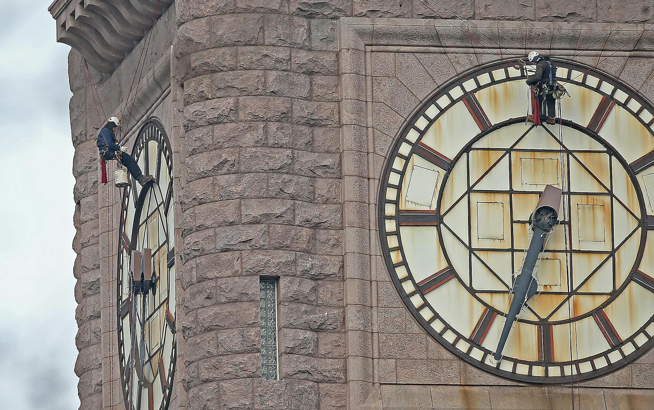 The historic clock atop City Hall stopped shortly after 6:30 a.m. to allow crew members to get inside the tower and gussy up the late-19th century landmark downtown, Monday, January 19, 2015 in Minneapolis, MN.
