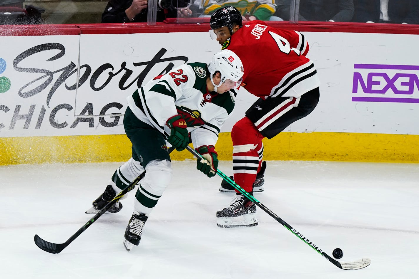 Wild left wing Kevin Fiala controls the puck against Blackhawks defenseman Seth Jones during the first period Friday night.