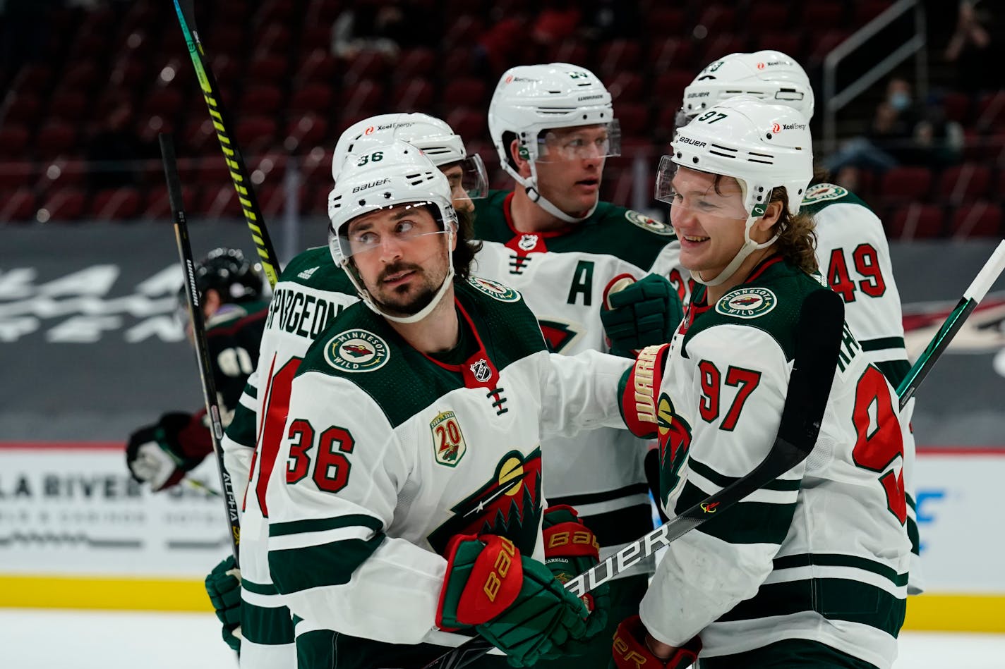 The Wild's Mats Zuccarello (36) celebrates with teammates Kirill Kaprizov (97), Victor Rask (49), Matt Dumba (24) and Jared Spurgeon (46) after scoring a goal against the Coyotes in the first period