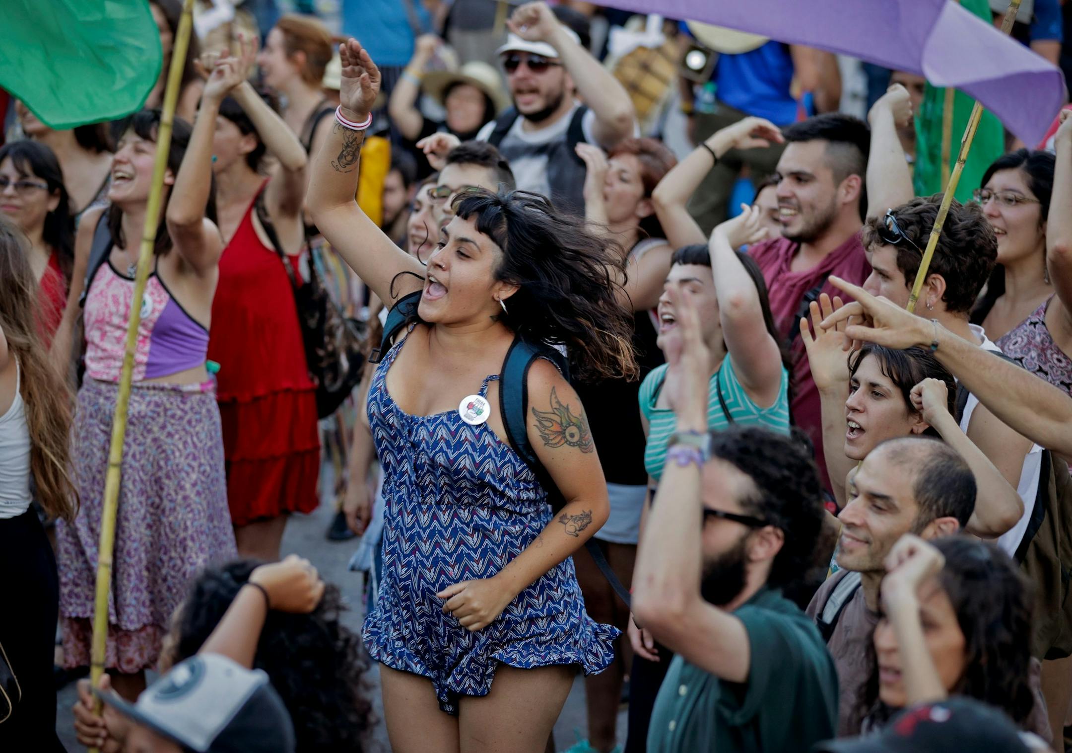 Activists from grassroots organizations from around the world chant slogans against free trade and the World Trade Organization conference, in Buenos Aires, Argentina, Sunday, Dec. 10, 2017. The WTO ministerial conference runs Dec. 10-14. (AP Photo/Victor R. Caivano) ORG XMIT: VC103