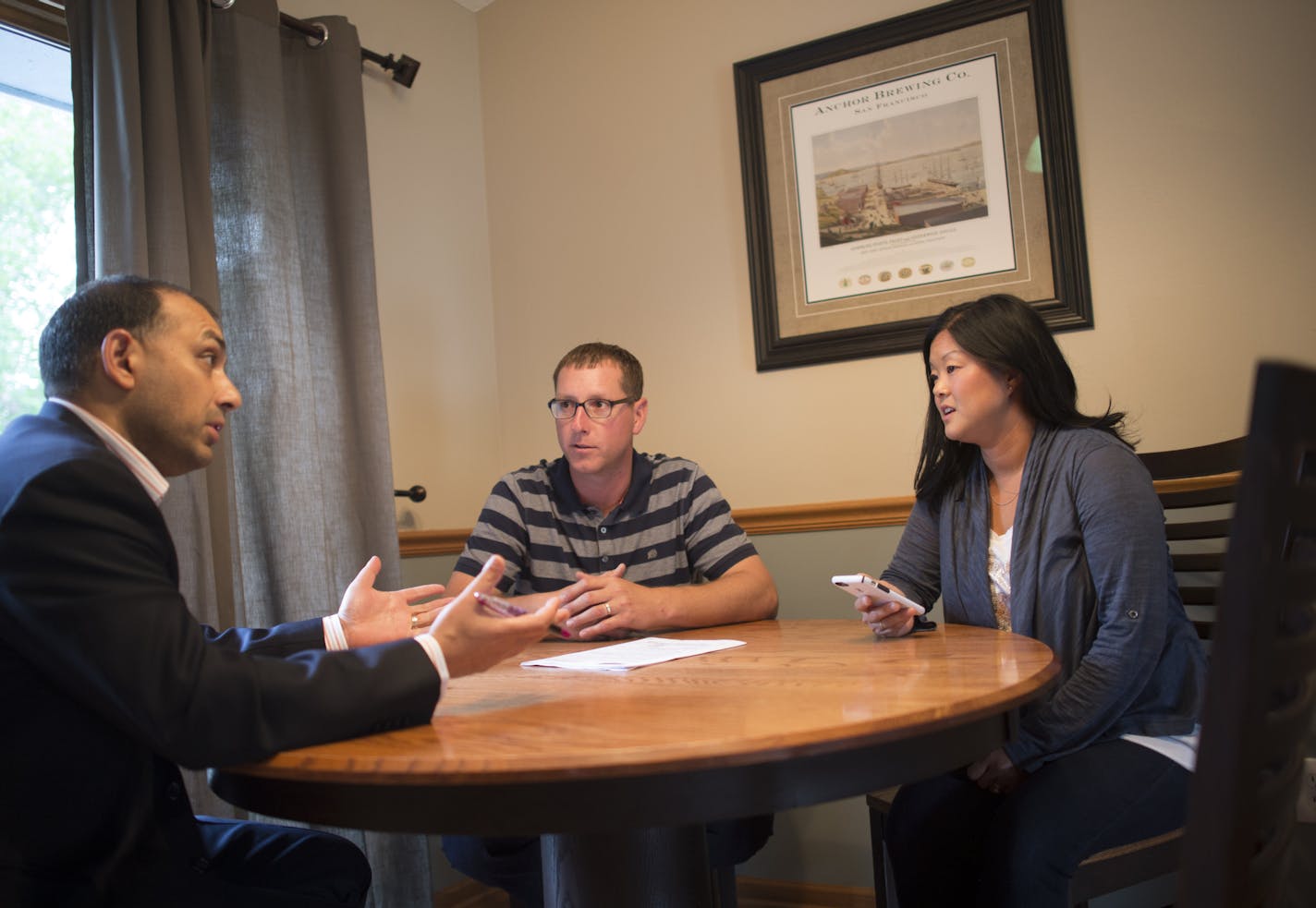 Jason and Kelli Biederwolf, right, met with real estate agent Nevin Raghuveer to discuss the purchasing agreement for their new home on Wednesday night. ] Aaron Lavinsky &#x2022; aaron.lavinsky@startribune.com May home sales in the Twin Cities metro posted another double-digit gain, according to monthly data from the Minneapolis Area Association of Realtors. Jason and Kelli Biederwolf got an offer on their house within three days of putting it on the market and they're starting to pack up. They