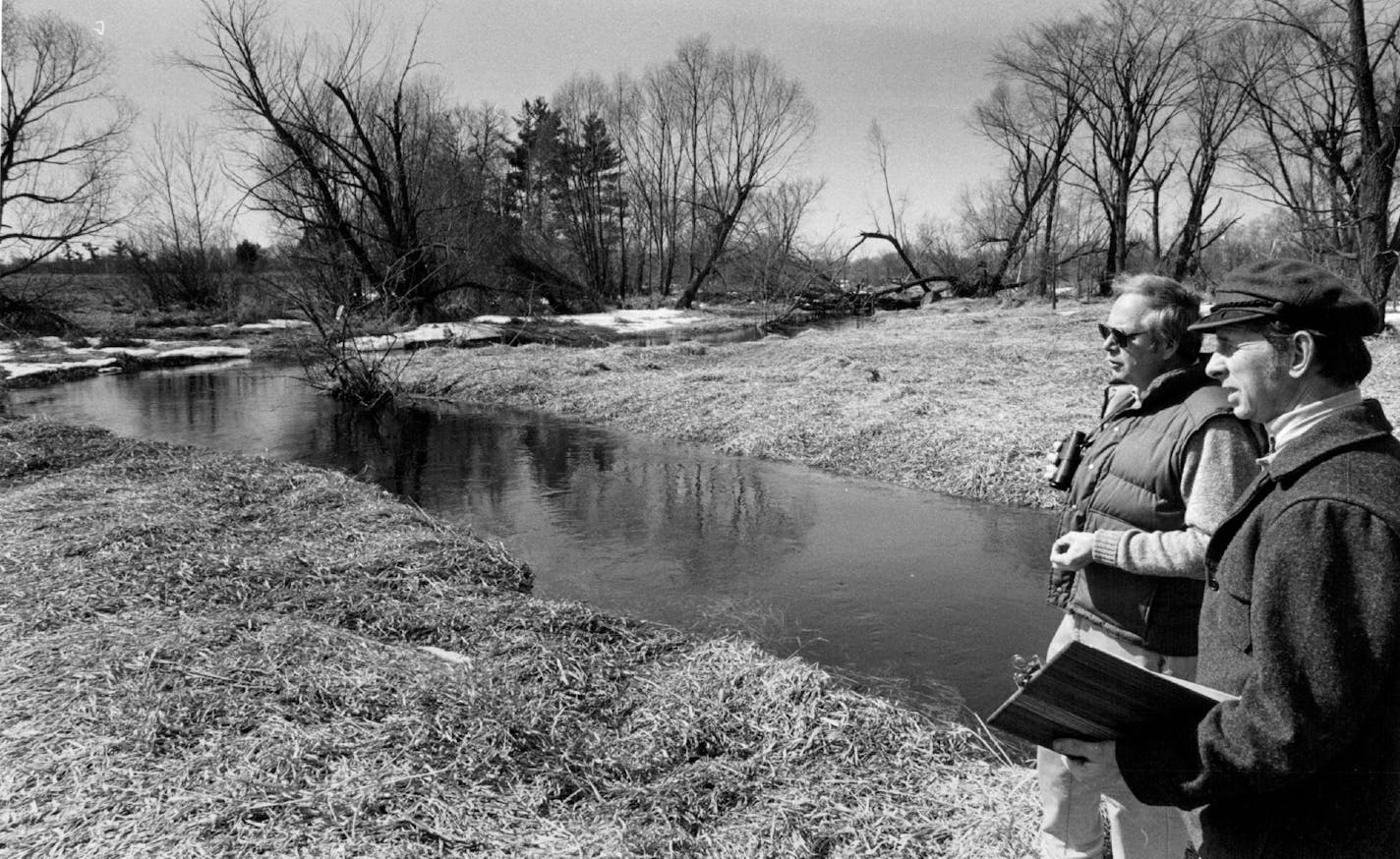 April 15, 1984 Director John Tester, Left, and Resident manager dave Bosanko Surveyed part of the Cedar Creek Natural History Area. ORG XMIT: MER389f0883046309938730637407dcf