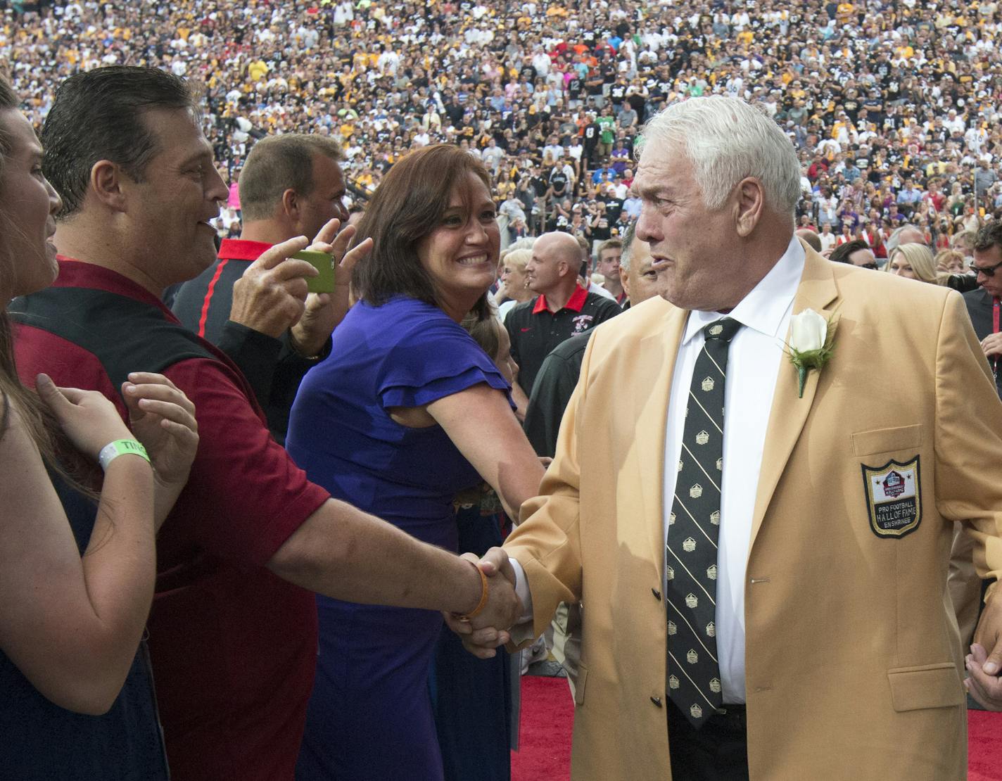 Former Vikings center Mick Tingelhoff shakes his son Pat's hand on the way to the stage for the introduction into the NFL Hall of Fame Saturday night in Canton Ohio. ] Tingelhoff played from 1962-78 and was All-Pro five times. He played in six Pro Bowls and never missed a game for the 17 seasons he played. Tingelhoff was eligible in 1984 and waited 31 years for his enshrinement Saturday night in Canton. ] The 2015 NFL Hall of Fame Class of 2015 Enshrinees - Jerome Bettis, Tim Brown, Charles Hale