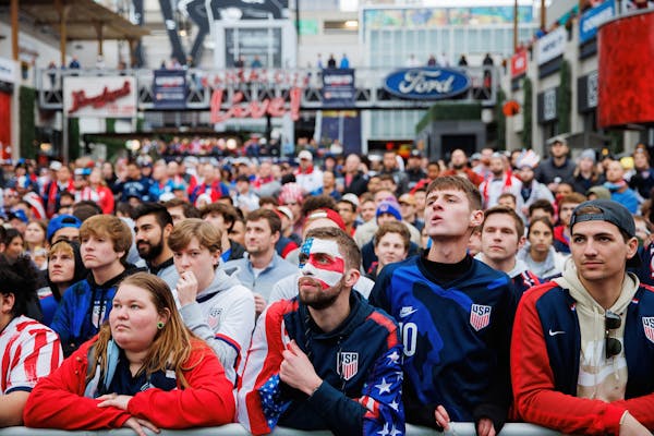 Fans at a watch party in Kansas City, Mo., watch the USA vs Iran match on Tuesday.