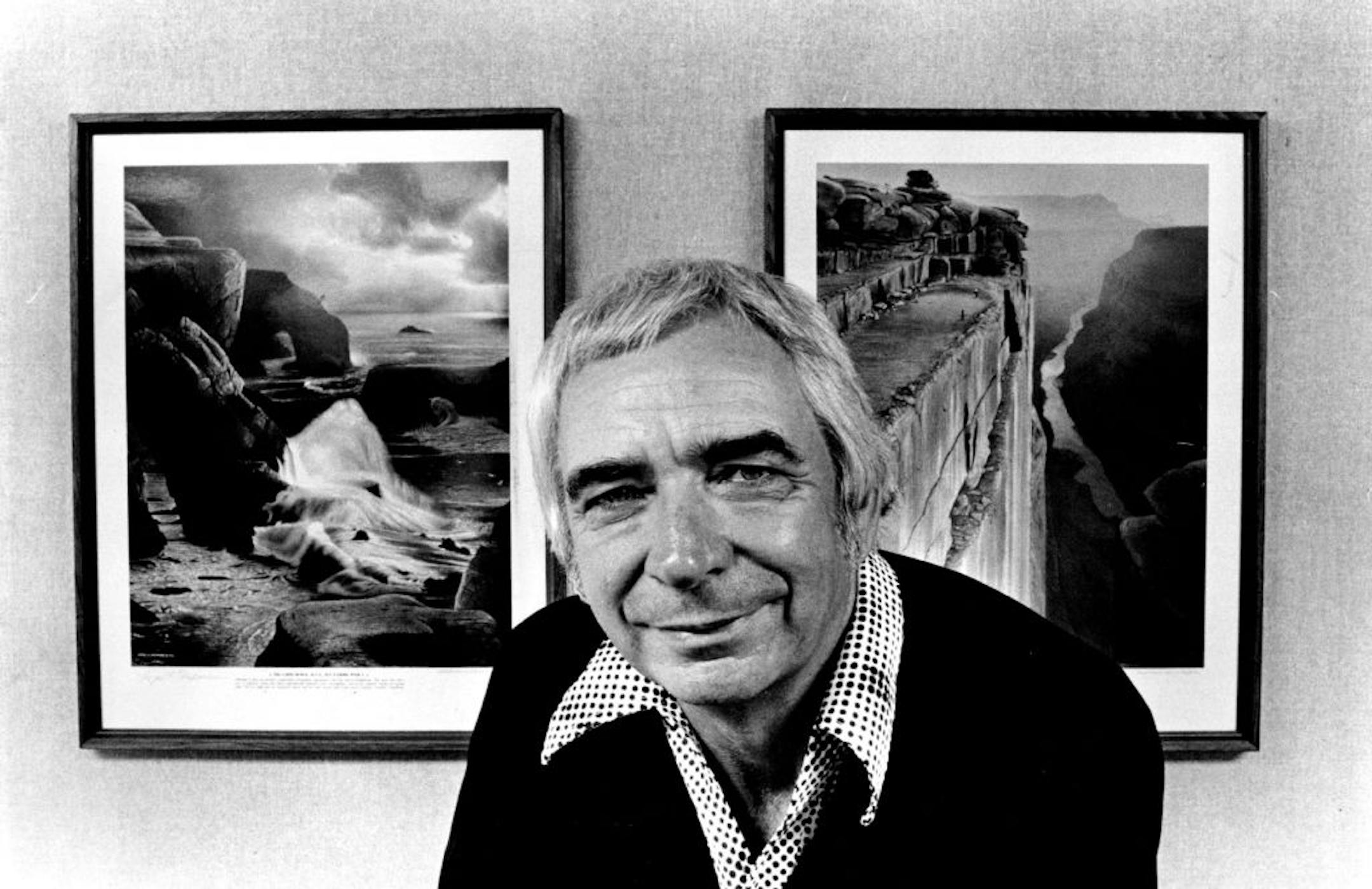 Artist-golfer Bud Chapman posed in front of paintings of his fantasy golf course in 1978.