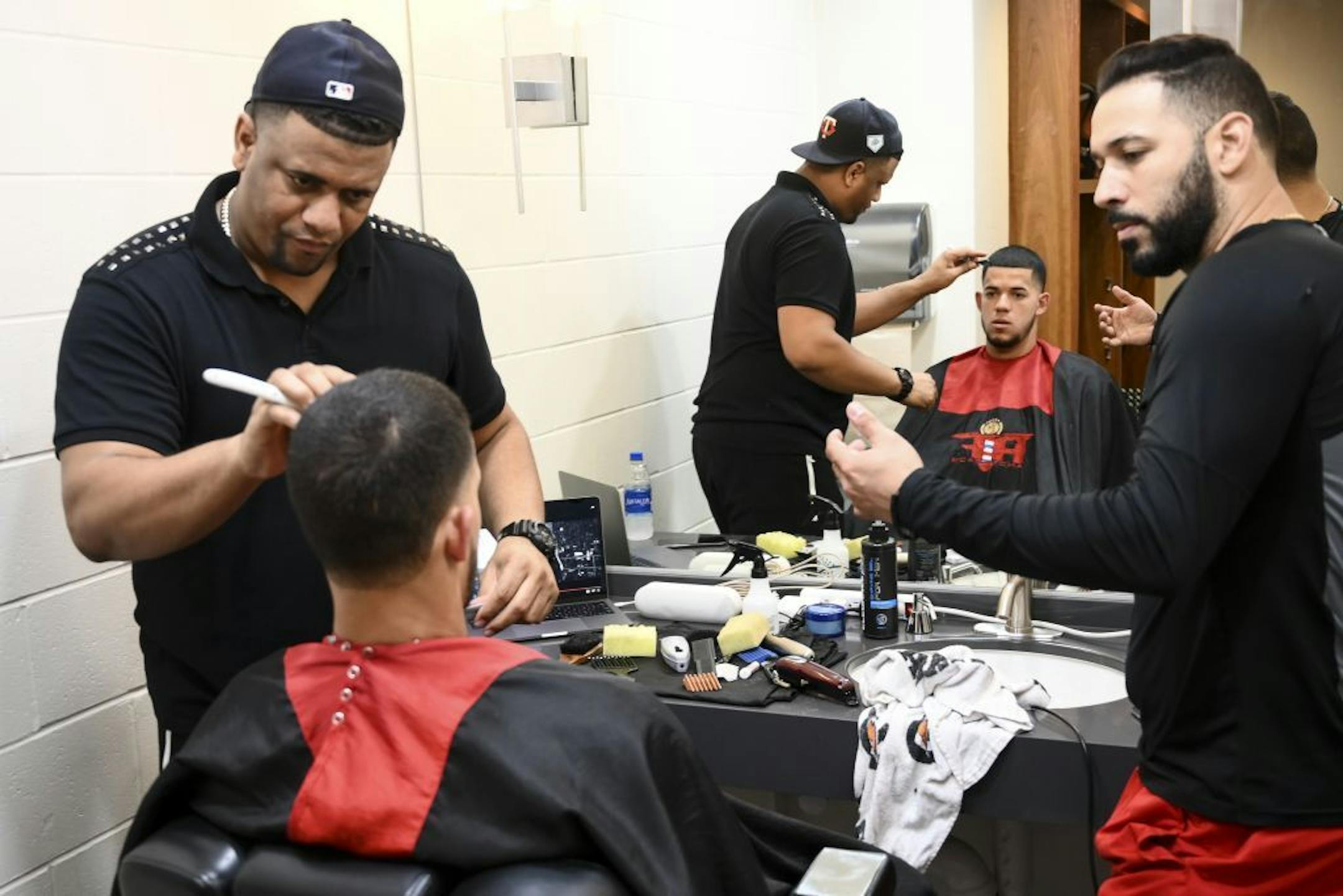 Twins outfielder Marwin Gonzalez talked to barber Andy "Fade" Duran as he cut Berrios' hair last month.