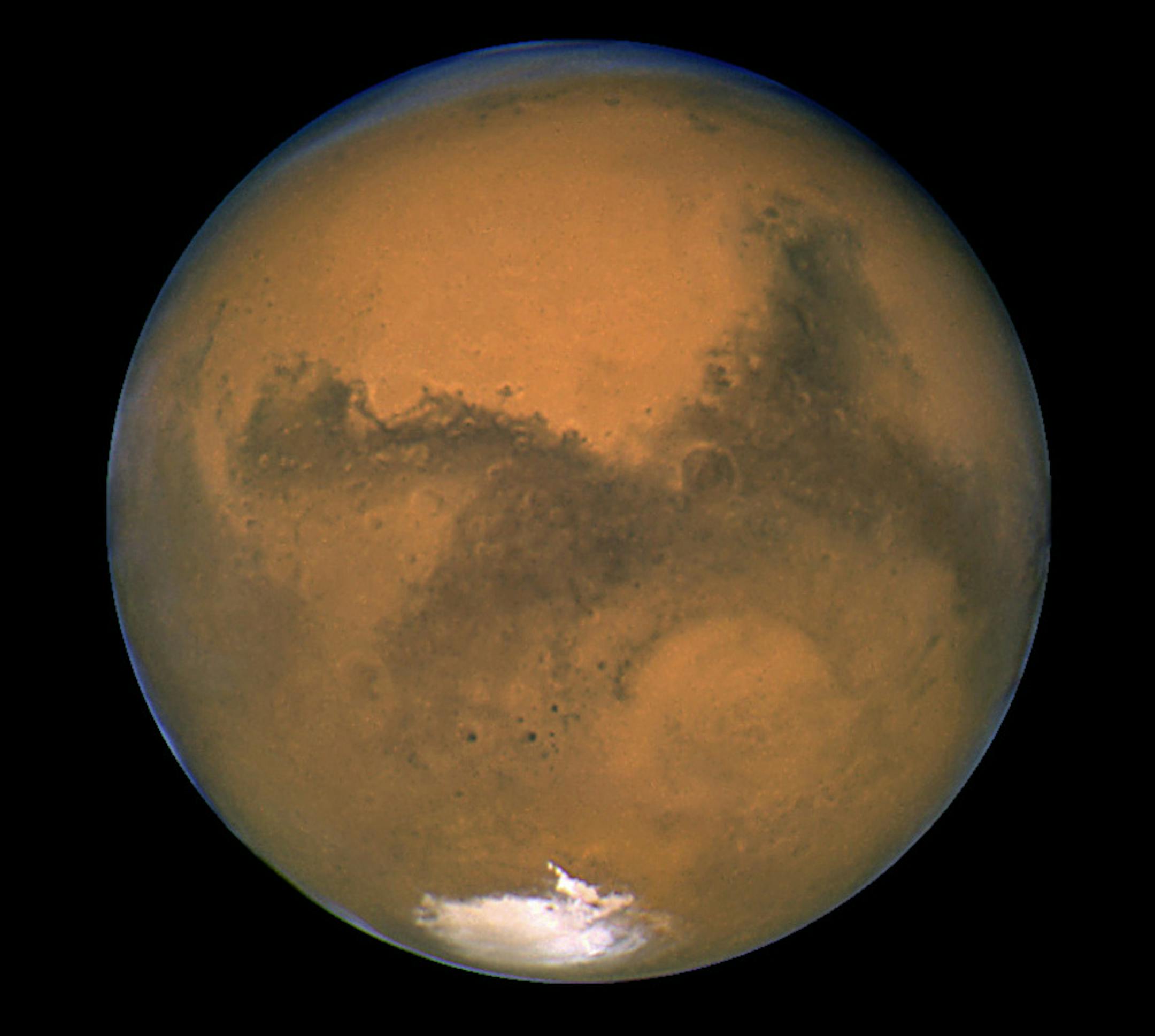 This Aug. 26, 2003 image made available by NASA shows Mars photographed by the Hubble Space Telescope on the planet's closest approach to Earth in 60,000 years. NASA&#xed;s robotic rover Curiosity landed safely on Mars late Sunday, Aug. 5, 2012 to begin two years of exploration. The mission cost $2.5 billion. (AP Photo/NASA) ORG XMIT: MIN2013011121161812 ORG XMIT: MIN1305171148540158 ORG XMIT: MIN1410151126210421