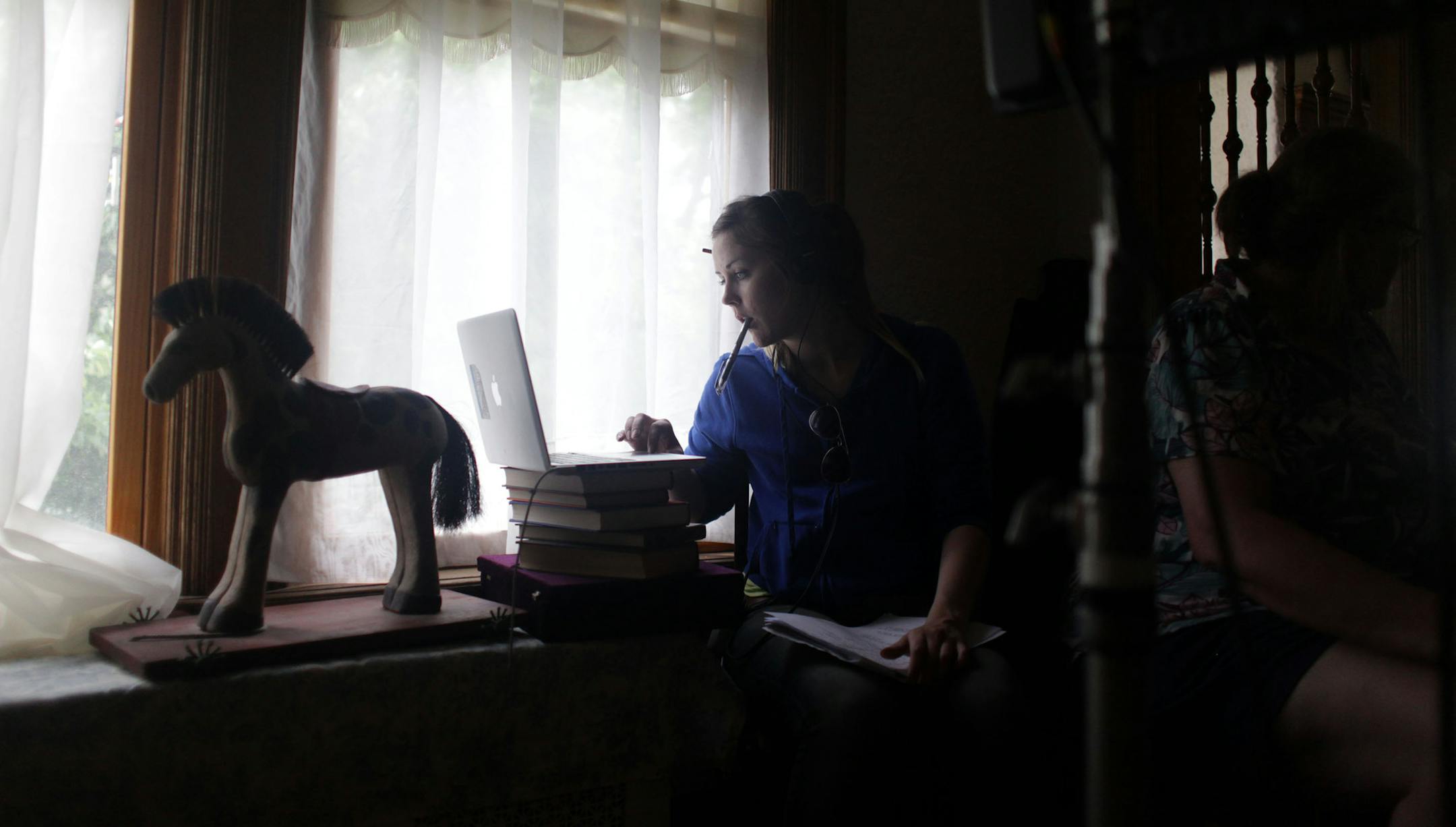 Katrina Filek, script supervisor for the project, sits near the shoot on Monday afternoon. A group of homeless Twin Cities kids began shooting for their screenplay they've been working on since February. ] Professional film crews are helping direct and produce the project. MONICA HERNDON monica.herndon@startribune.com St. Paul, MN 06/16/2014