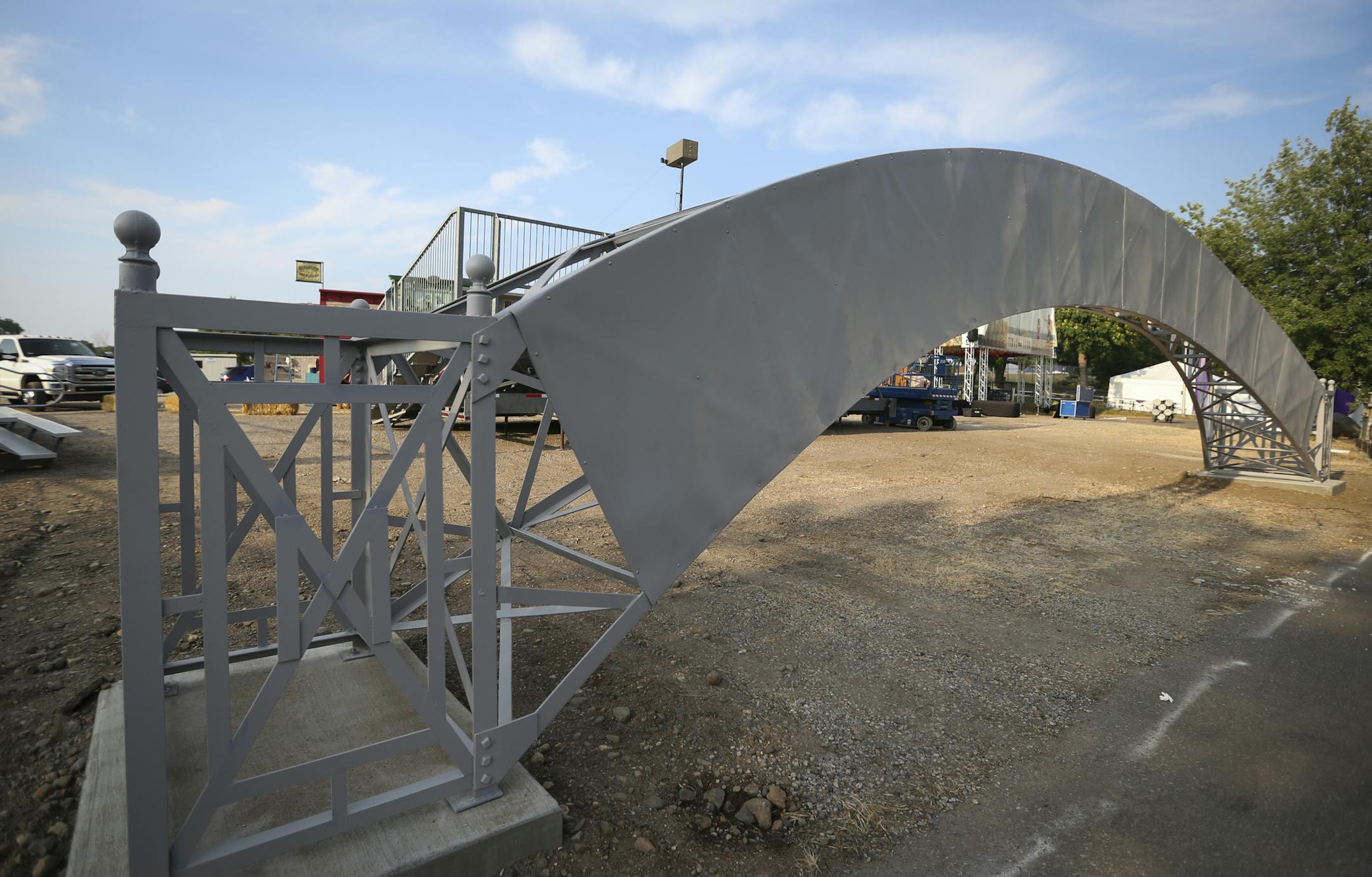 A battered and rusting metal sign rescued from a wooded area of the Minnesota State Fair grounds which once greeted fairgoers as they stepped off the streetcar will again greet them when a new transit center is built to replace Heritage Square next year. The restored arched sign will be on display when the fair opens Thursday. Photographed on Wednesday, August 21, 2013, in Falcon Heights, Minn. ] (RENEE JONES SCHNEIDER &#x201a;&#xc4;&#xa2; reneejones@startribune.com)
