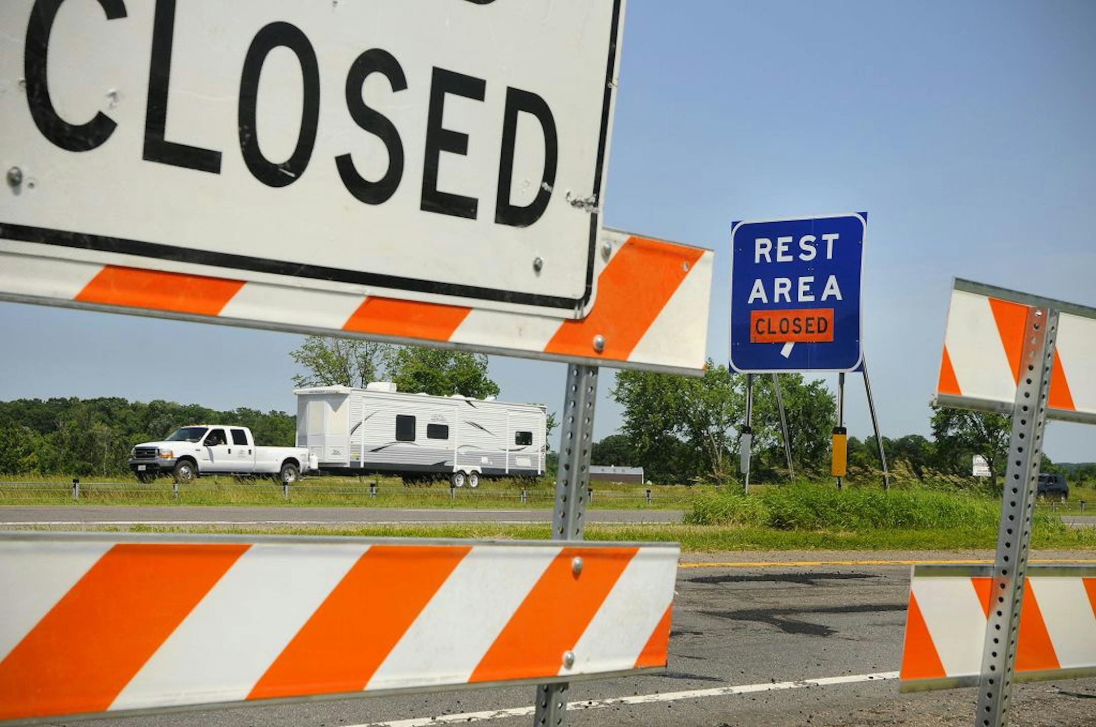 Signs are posted and barricades are out closing the rest areas on the east and west bound lanes of Interstate 94 near Avon, Minn., Wednesday, June 29, 2011. Rest areas around St. Cloud, Minn., are being closed because of the possible state shutdown. (AP Photo/St.Cloud Times, Jason Wachter) NO SALES