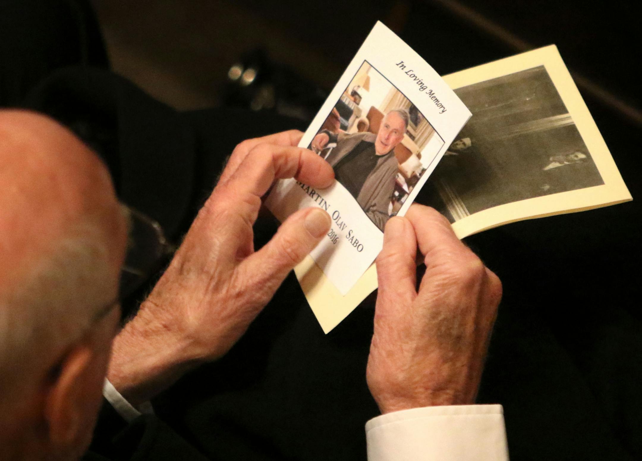 A man holds a program before the start of funeral services for Martin Olav Sabo, the former Minnesota Congressman Saturday, March 19, 2016, at Central Lutheran Church in downtown Minneapolis, MN.