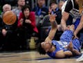Orlando Magic's Khem Birch, lower left, makes a pass to a teammate after grabbing a loose ball off the court during the second half of an NBA basketba