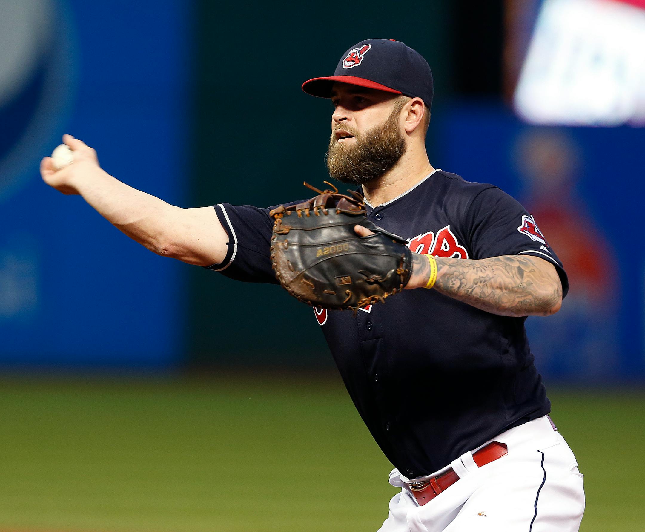 Cleveland Indians' Mike Napoli throws out Minnesota Twins' Miguel Sano at first base during the fourth inning of a baseball game Wednesday, Aug. 31, 2016, in Cleveland. (AP Photo/Ron Schwane)