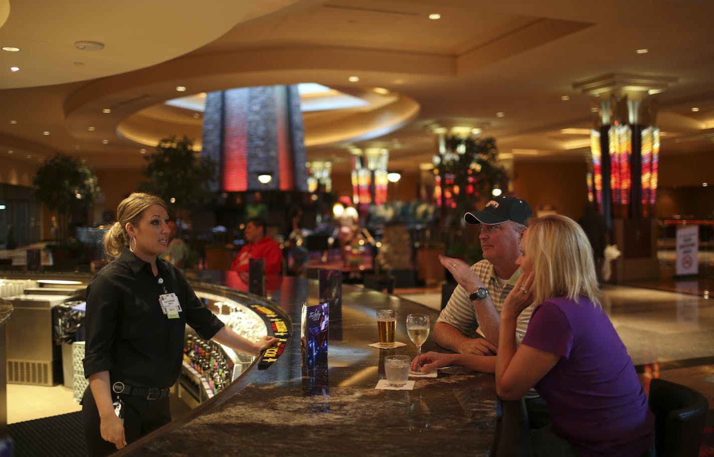 Mystic Lake Casino was a "dry" establishment for many years until it quietly began serving alcohol last year. Now it's ready to make a bigger splash, with three new bars on the casino floor and a grand opening bash Saturday aimed at courting the nightclubbing crowd. Bartender Katie Stirzl chatted with patrons Scott and Jodi Rassett of Prior Lake in the Lobby Lounge Monday night, August 19, 2013, one of the new bars at Mystic Lake Casino in Prior Lake. ] JEFF WHEELER &#x201a;&#xc4;&#xa2; jeff.whe