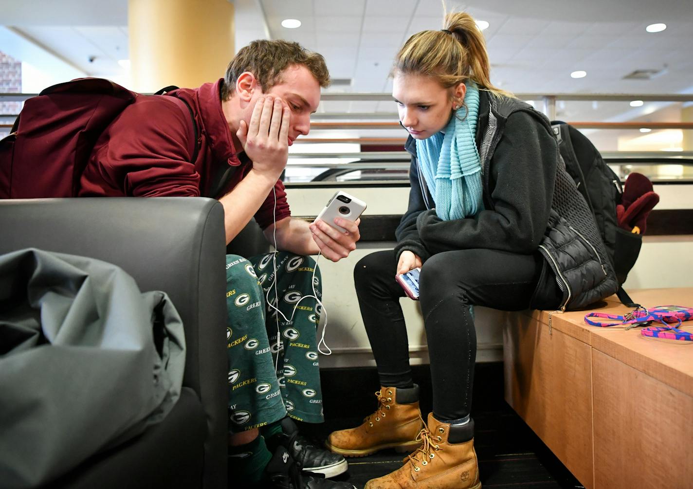 University of Minnesota students senior Johnny Dietz and junior Anna Boyd looked over tweets with the hashtag #WeHadEnough, relating to the football team and expanding into other issues. ] GLEN STUBBE * gstubbe@startribune.com Friday, December 16, 2016 Taking the pulse of students, staff, donors at the University of Minnesota in the aftermath of the football team's boycott of a coming bowl game following the suspension of 10 players off a sexual assault allegation in September.