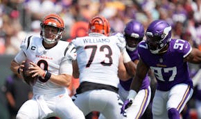 Cincinnati quarterback Joe Burrow scrambled away from Vikings defensive end Everson Griffen on Sunday. 