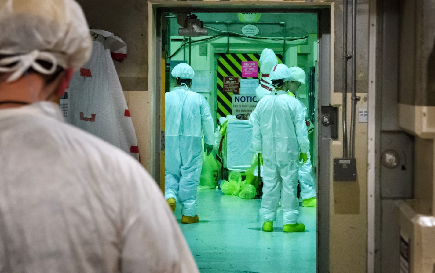 Workers pass through a maintenance airlock while Unit 2 undergoes a planned shutdown to replace spent fuel rods. Prairie Island Nuclear Power Plant in Welch, MN. ] GLEN STUBBE &#x2022; glen.stubbe@startribune.com Thursday, November 2, 2017 Prairie Island Nuclear Power Plant in Welch, MN, near Red Wing, is undergoing a planned outage in Unit 2 allowing the replacement of fuel rods.