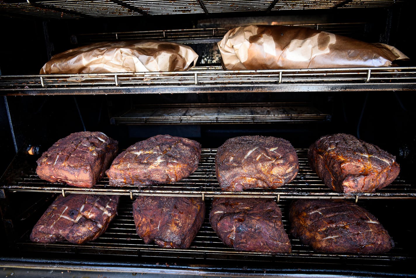 Pork butts and briskets being smoked at OMC Smokehouse Thursday. ] AARON LAVINSKY &#x2022; aaron.lavinsky@startribune.com Annual food travel issue heads to Duluth, where a lot of new restaurants are popping up. We photograph restaurants and scenic Duluth on Wednesday, June 6 and Thursday, June 7, 2018.