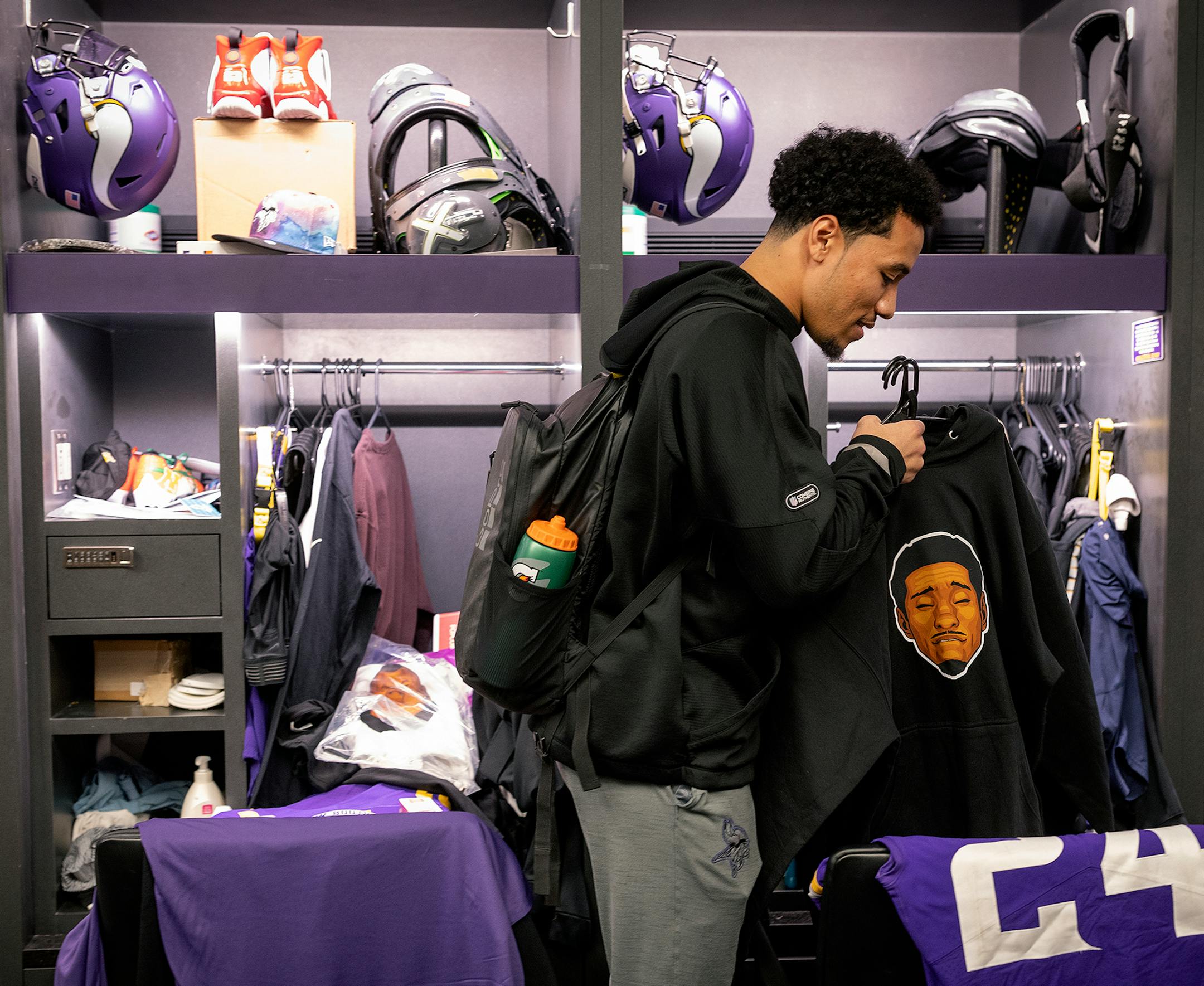 Minnesota Vikings safety Camryn Bynum (24) cleans out his locker in the locker room at the TCO Performance Center.