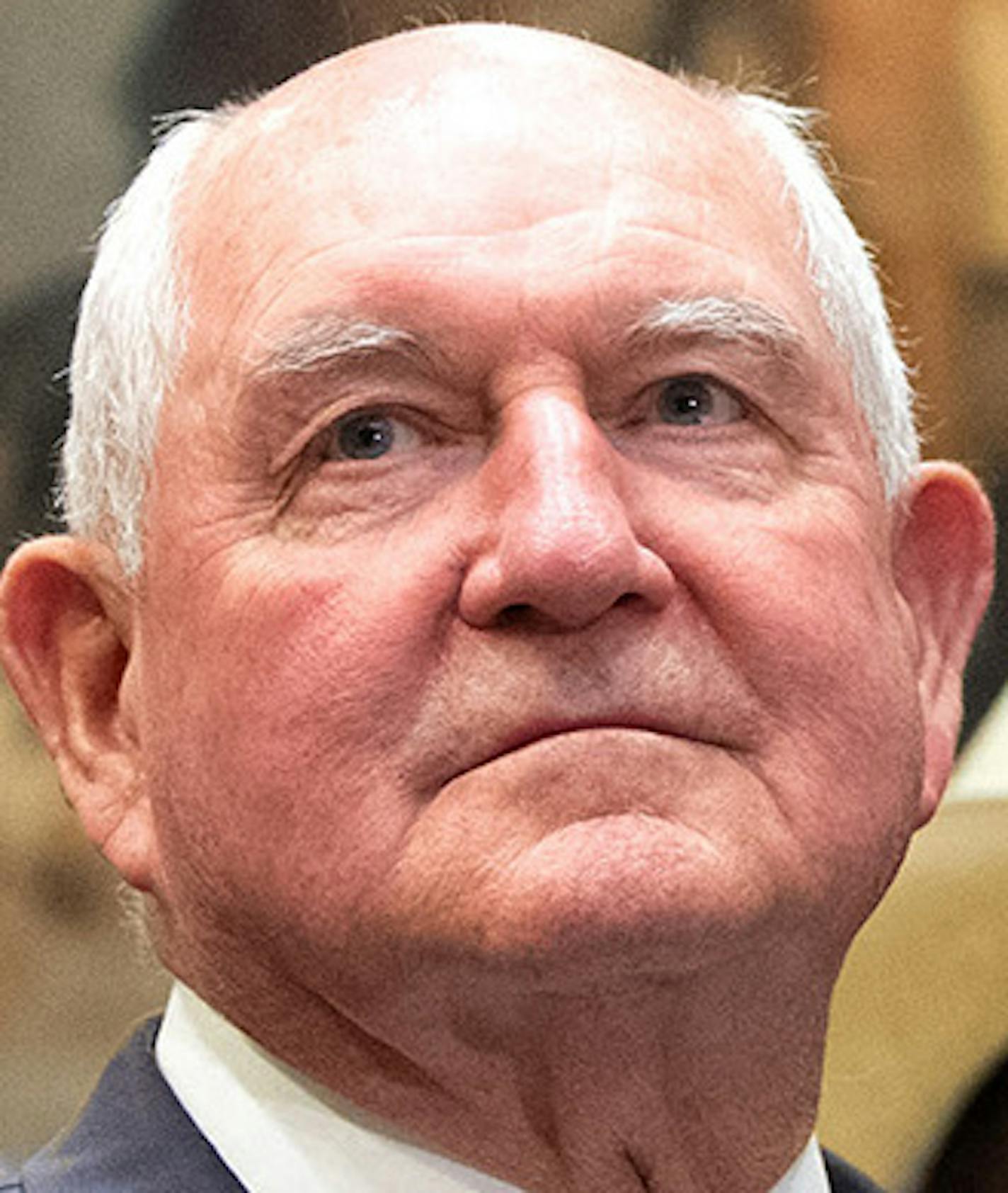 President Donald Trump is joined by Agriculture Secretary Sonny Perdue as he delivers remarks on supporting American farmers, in the Roosevelt Room at the White House on March 23, 2019 in Washington, D.C. U.S. agriculture officials are preparing to roll out another $16 billion in aid to farmers. (Kevin Dietsch/UPI/Abaca Press/TNS)