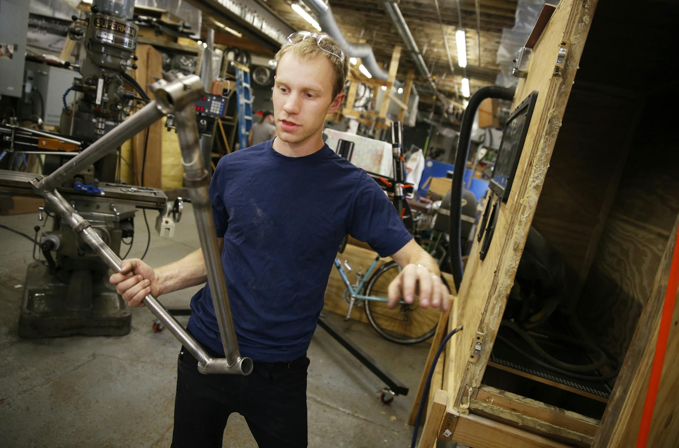 At his workshop in south Minneapolis, 25-year-old Alex Cook bike frame builder worked on a custom made stainless steel frames, his specialty. ] tsong-taataarii@startribune.com